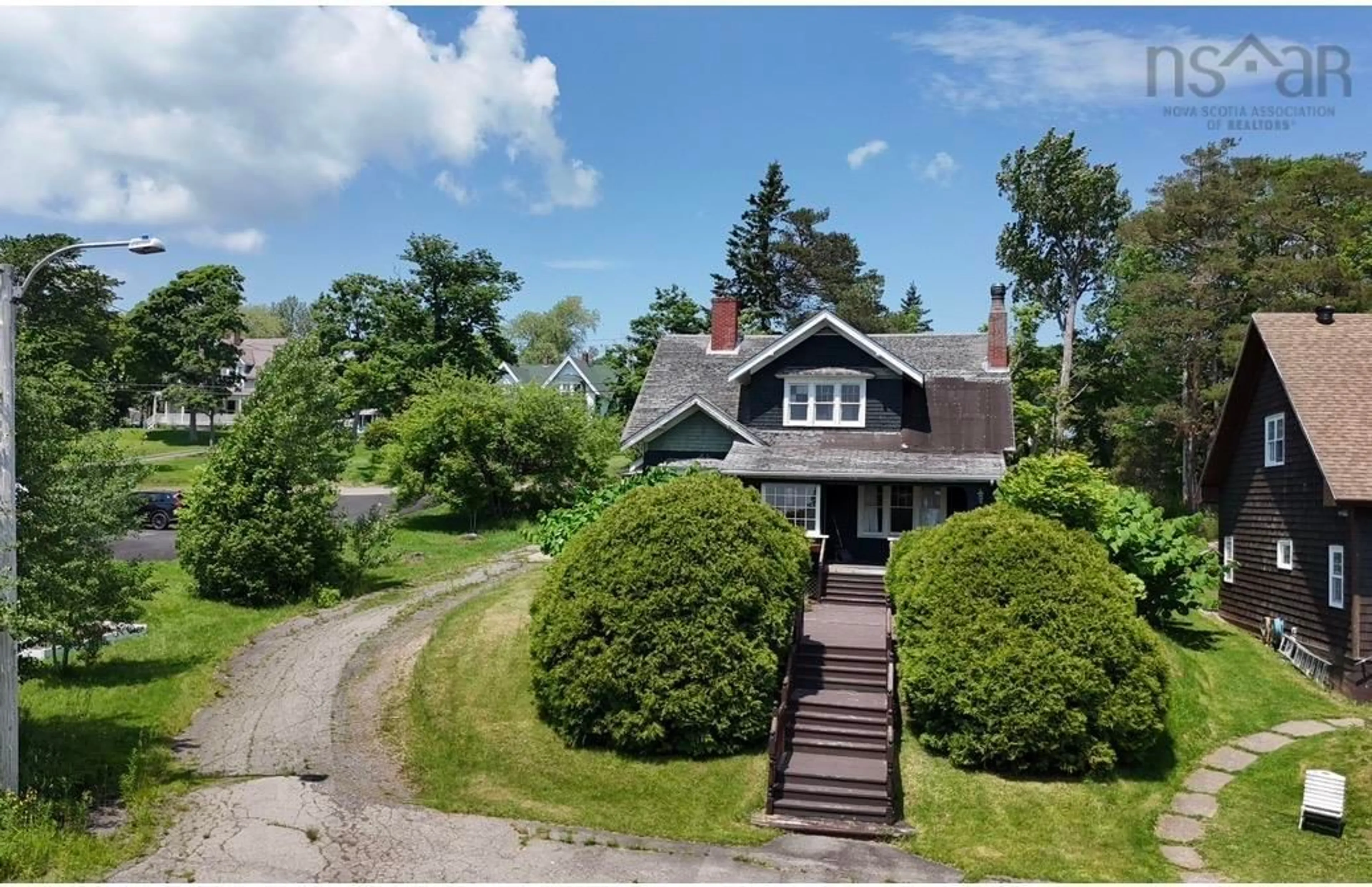 A pic from outside/outdoor area/front of a property/back of a property/a pic from drone, street for 43 Grant St, Baddeck Nova Scotia B0E 1B0