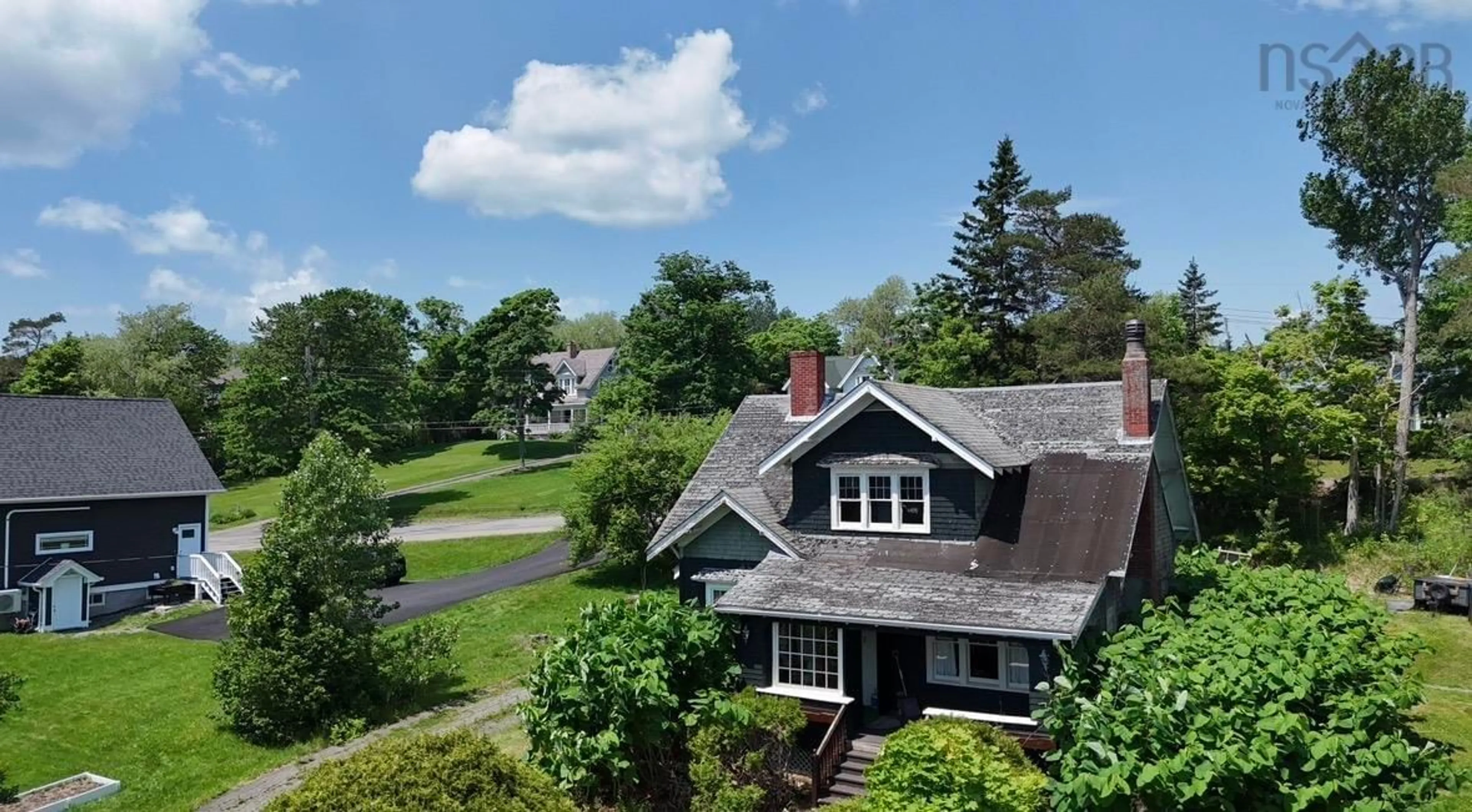 A pic from outside/outdoor area/front of a property/back of a property/a pic from drone, street for 43 Grant St, Baddeck Nova Scotia B0E 1B0