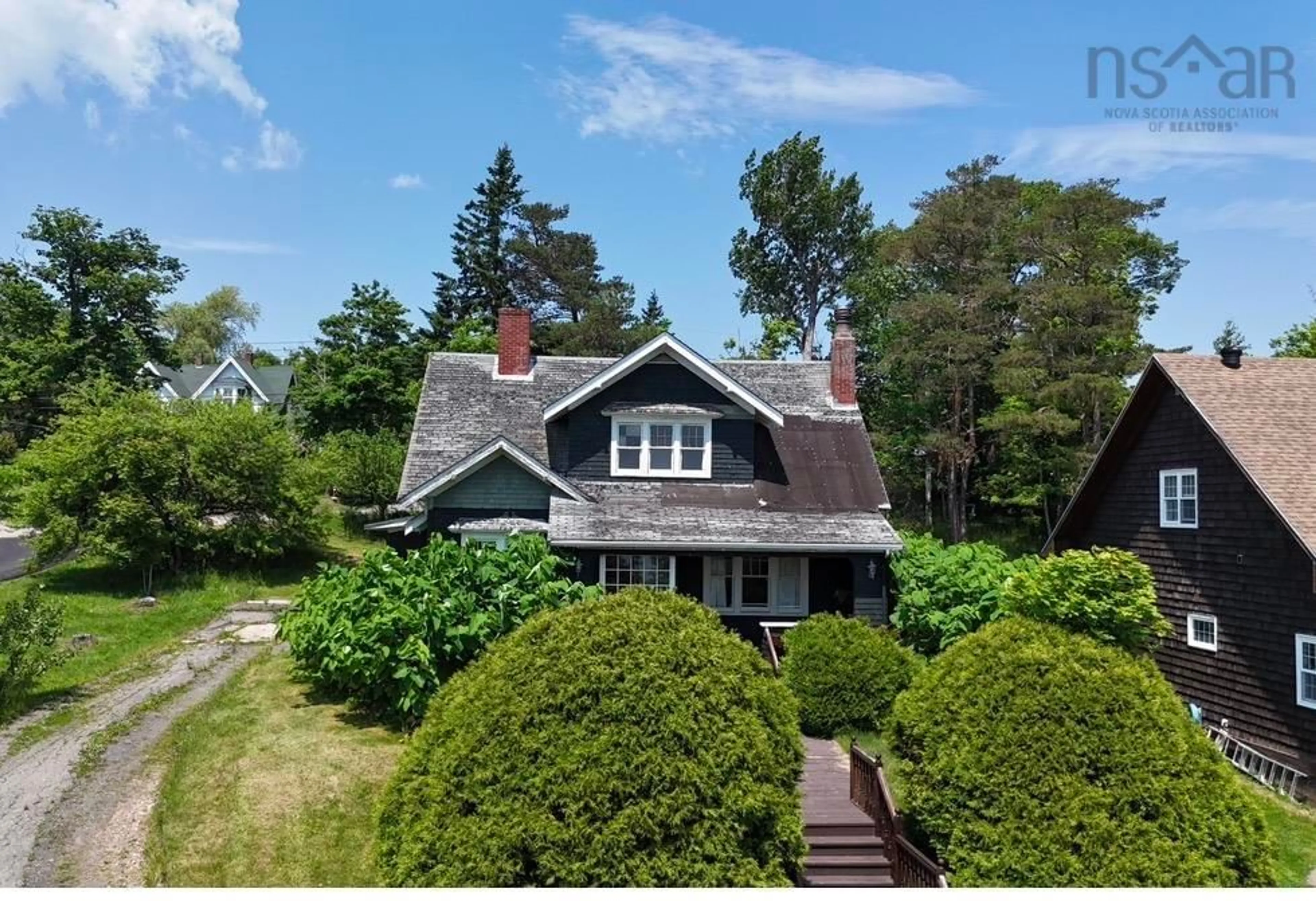 A pic from outside/outdoor area/front of a property/back of a property/a pic from drone, street for 43 Grant St, Baddeck Nova Scotia B0E 1B0