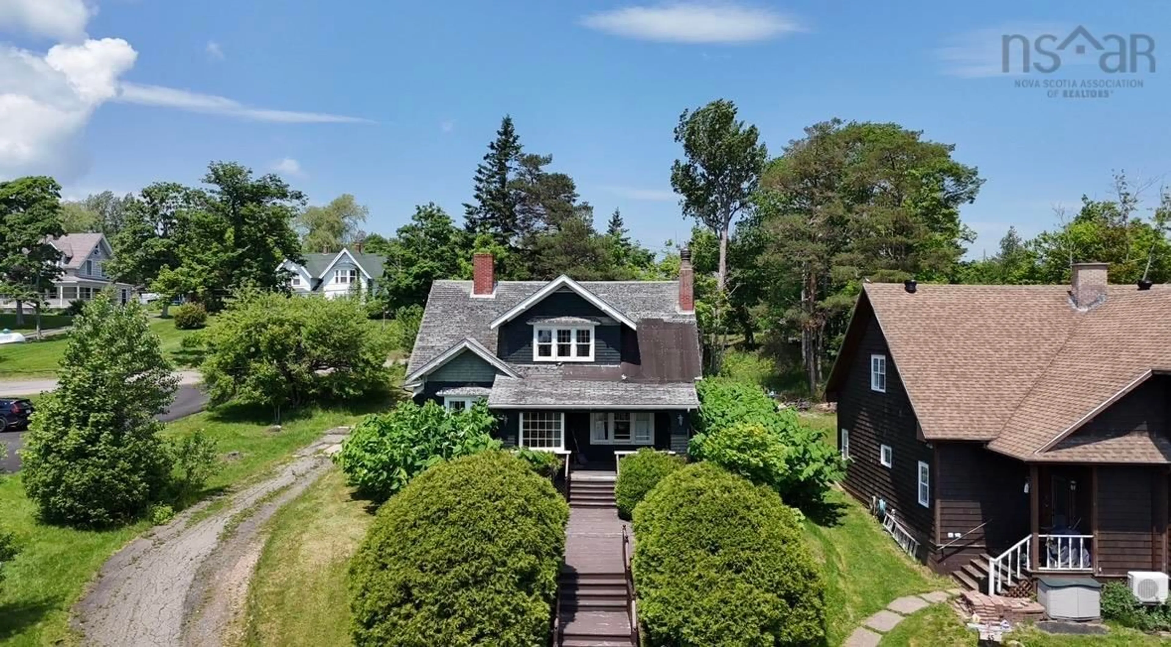 A pic from outside/outdoor area/front of a property/back of a property/a pic from drone, street for 43 Grant St, Baddeck Nova Scotia B0E 1B0