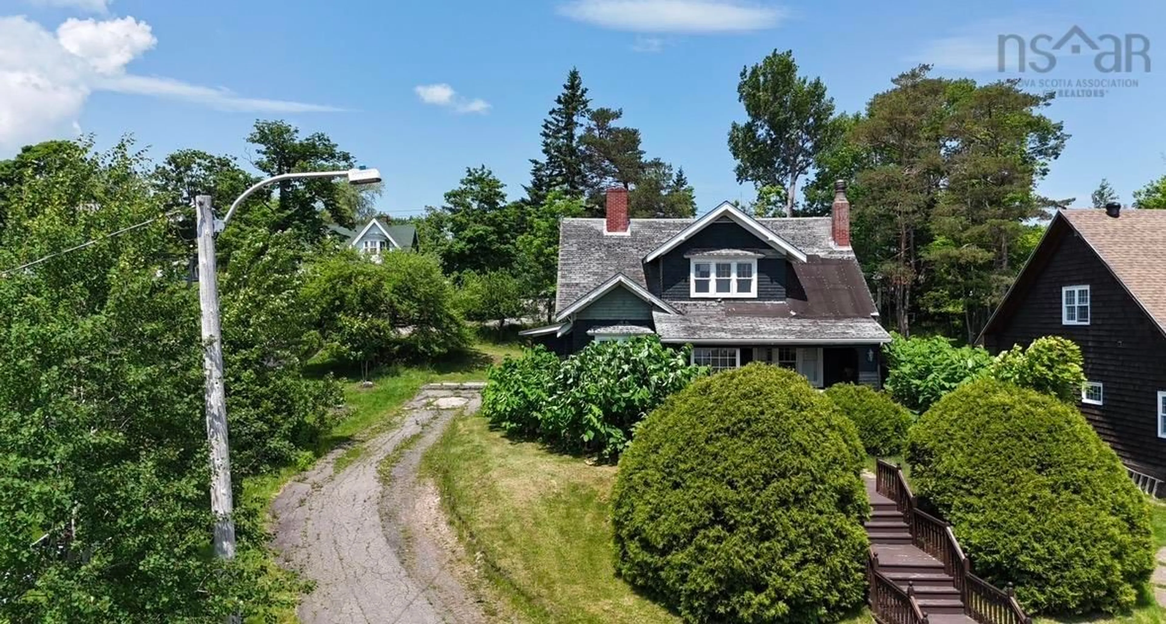 A pic from outside/outdoor area/front of a property/back of a property/a pic from drone, street for 43 Grant St, Baddeck Nova Scotia B0E 1B0
