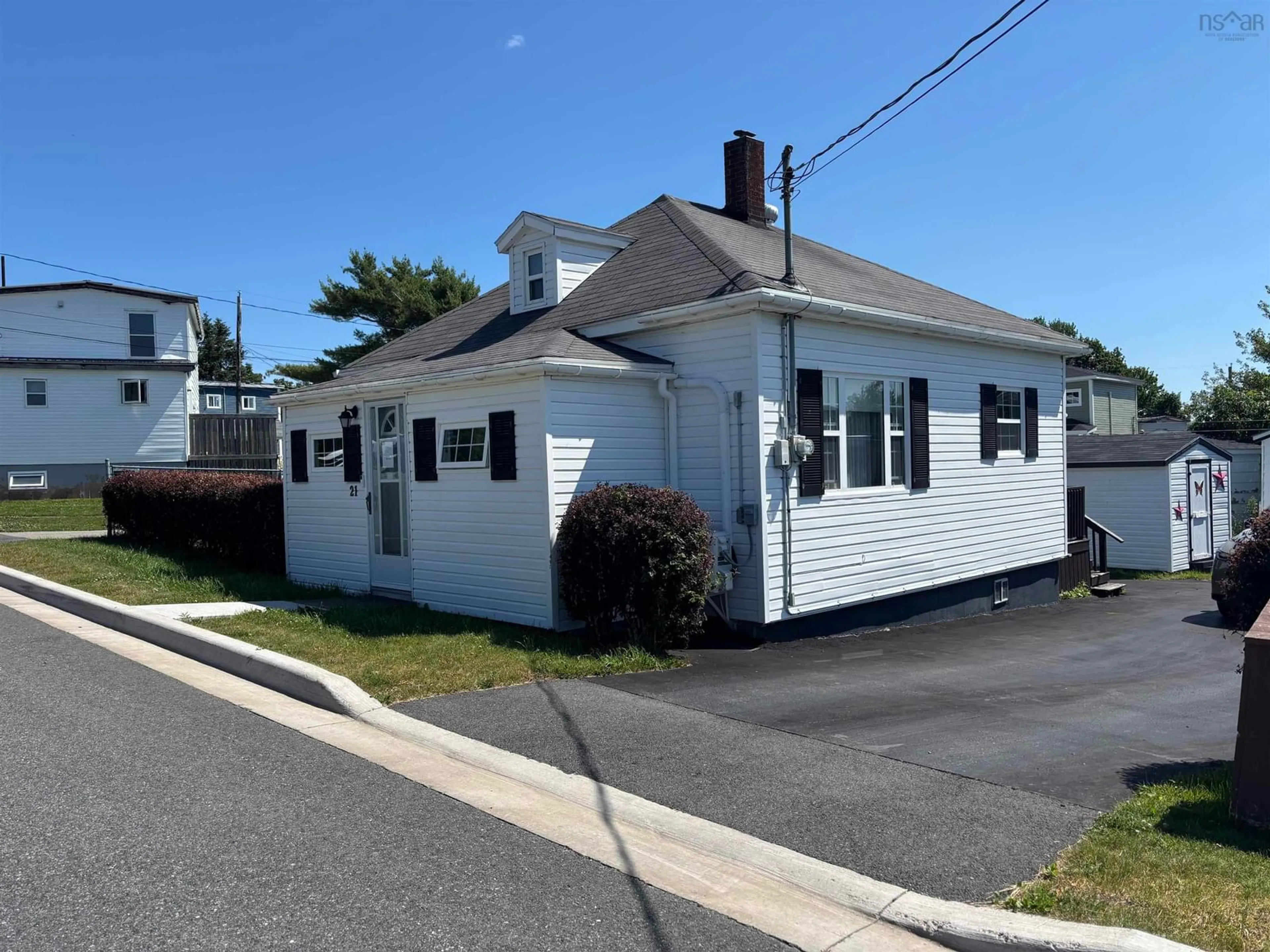 Home with vinyl exterior material, street for 21 Clifford St., North Sydney Nova Scotia B2A 1X2