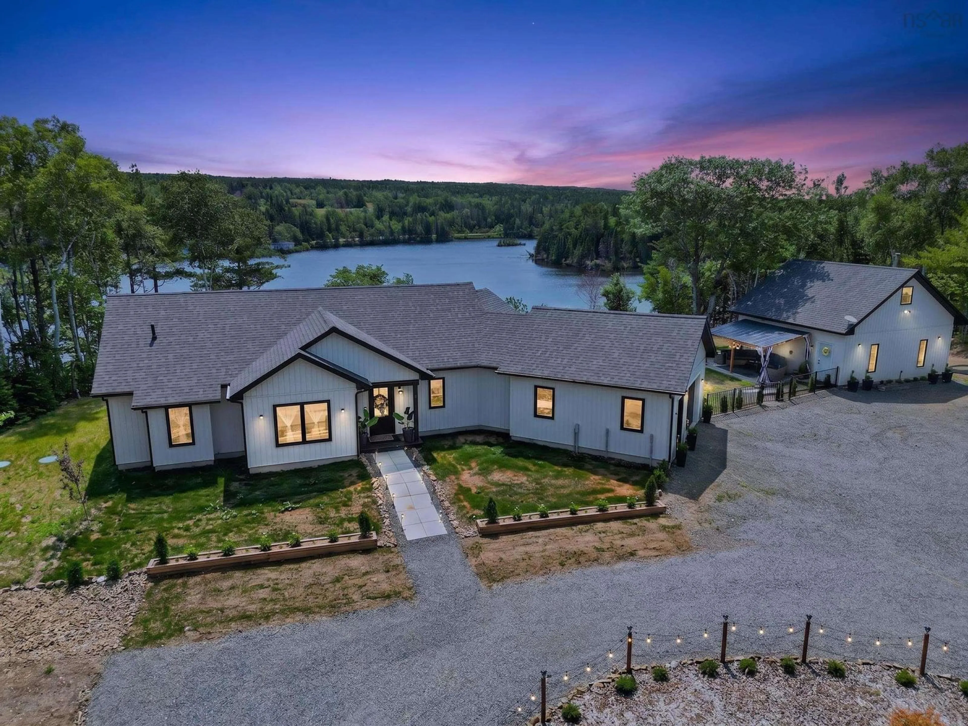 A pic from outside/outdoor area/front of a property/back of a property/a pic from drone, water/lake/river/ocean view for 188 Sheiling Dr, Marion Bridge Nova Scotia B1K 0B3