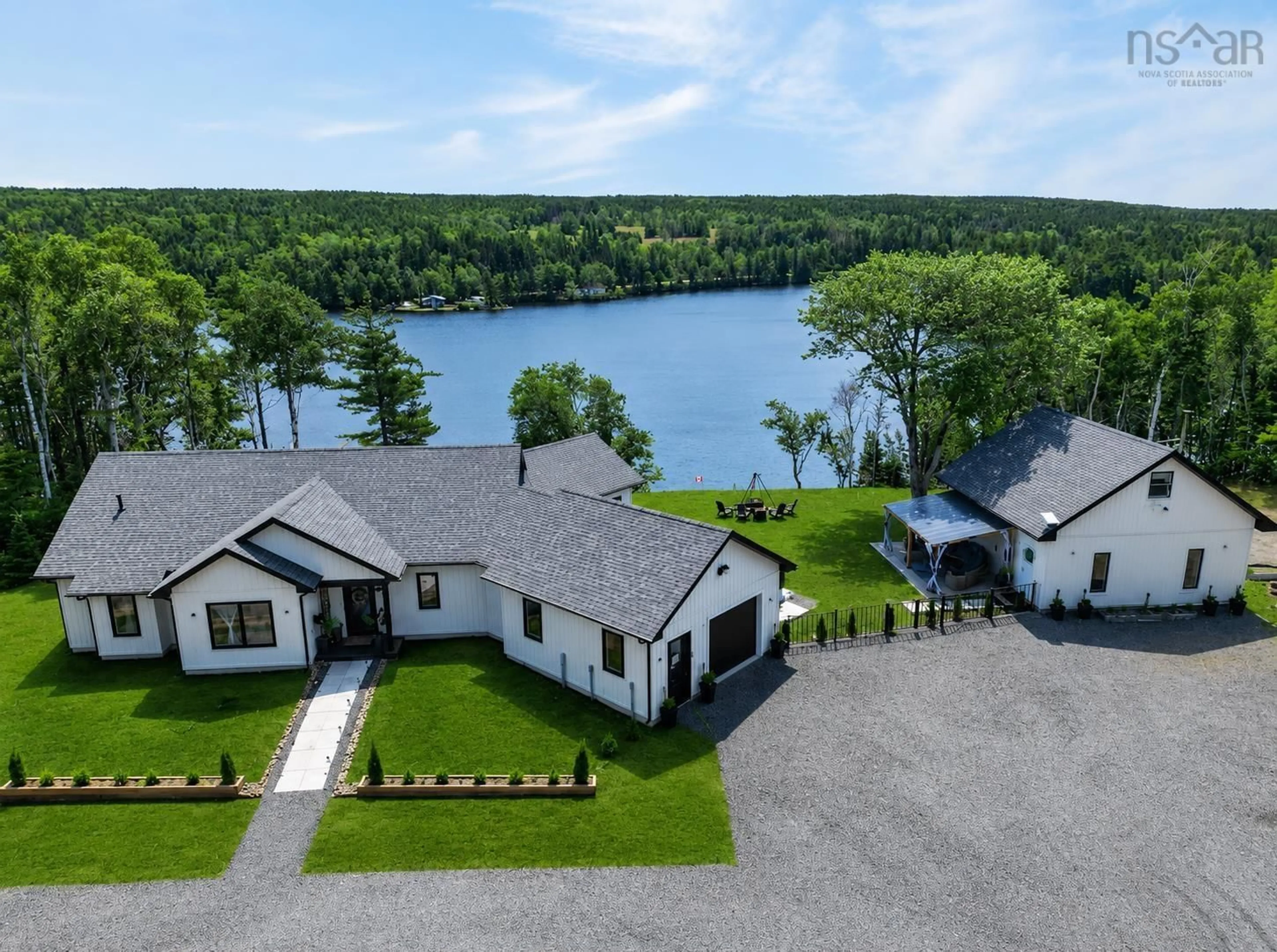 A pic from outside/outdoor area/front of a property/back of a property/a pic from drone, water/lake/river/ocean view for 188 Sheiling Dr, Marion Bridge Nova Scotia B1K 0B3