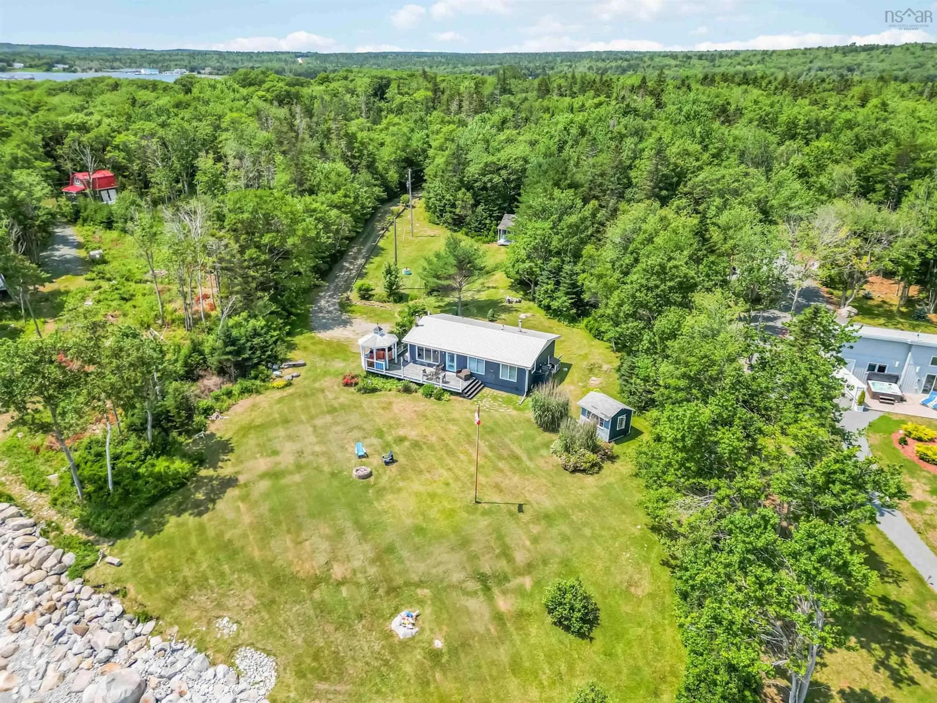 A pic from outside/outdoor area/front of a property/back of a property/a pic from drone, water/lake/river/ocean view for 258 Bells Point Rd, Port Mouton Nova Scotia B0T 1T0