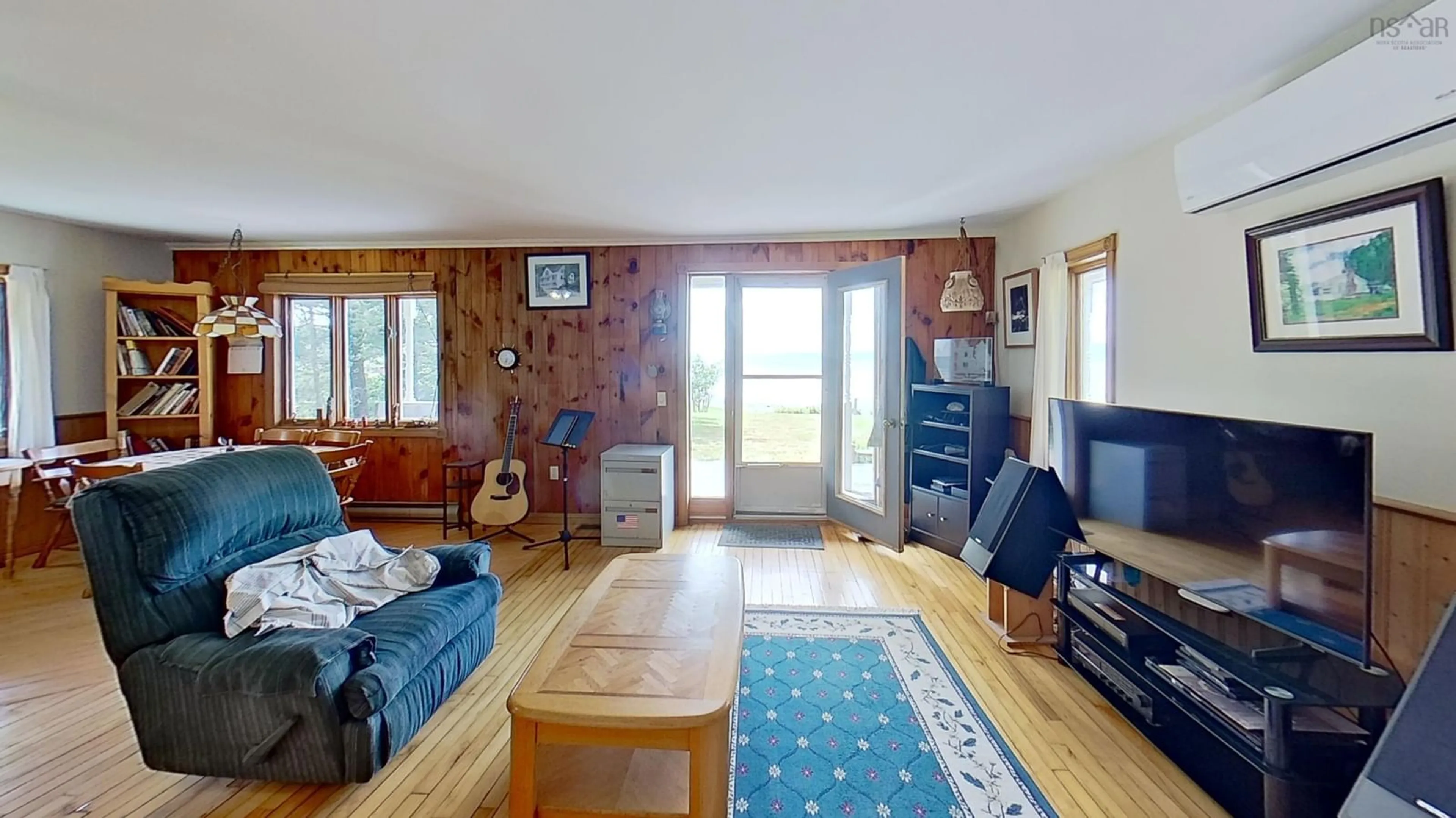 Living room with furniture, wood/laminate floor for 8965 Ns-101, Brighton Nova Scotia B0V 1A0