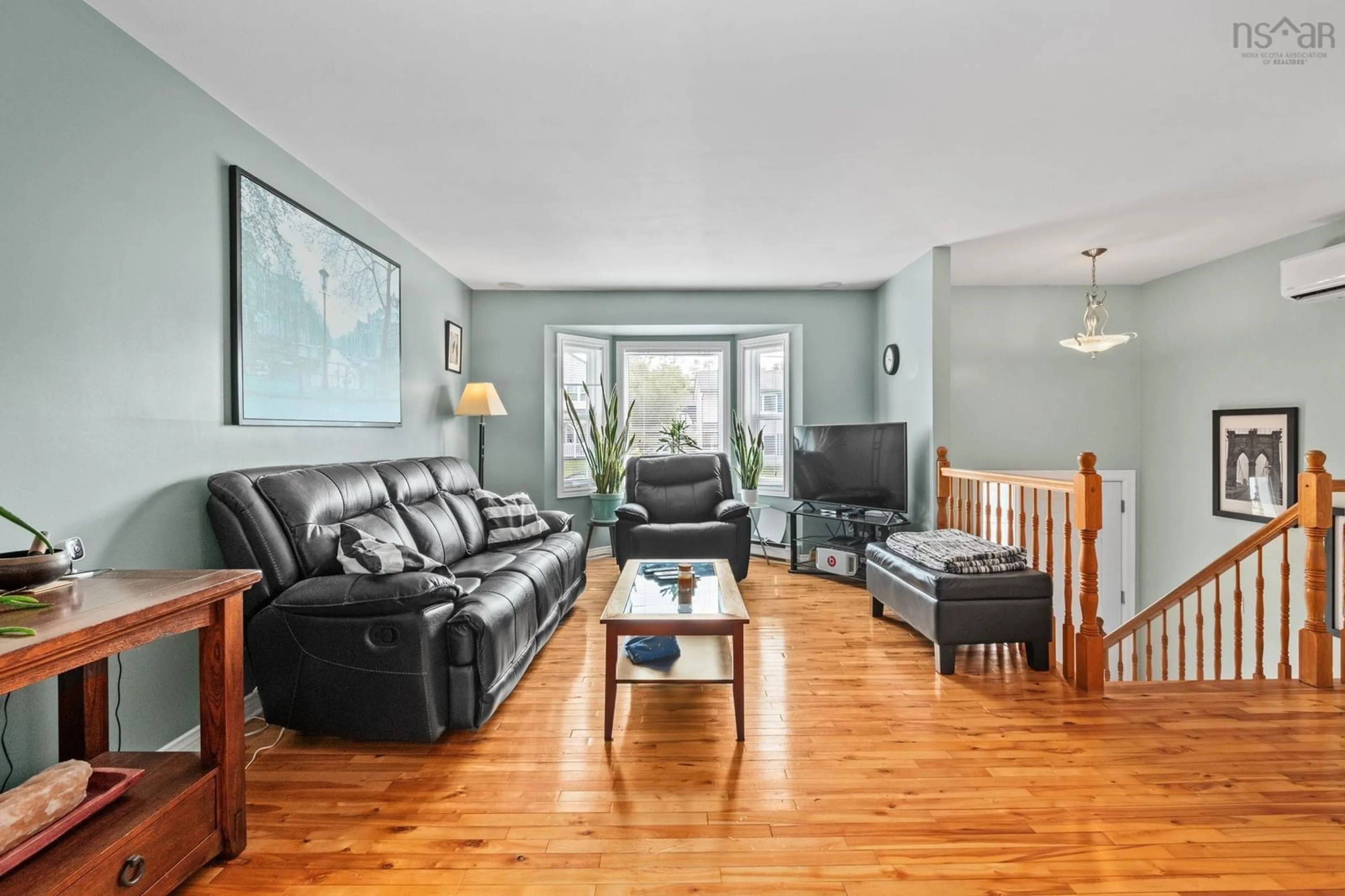 Living room with furniture, wood/laminate floor for 100 Governors Lake Rd, Timberlea Nova Scotia B3T 1A4