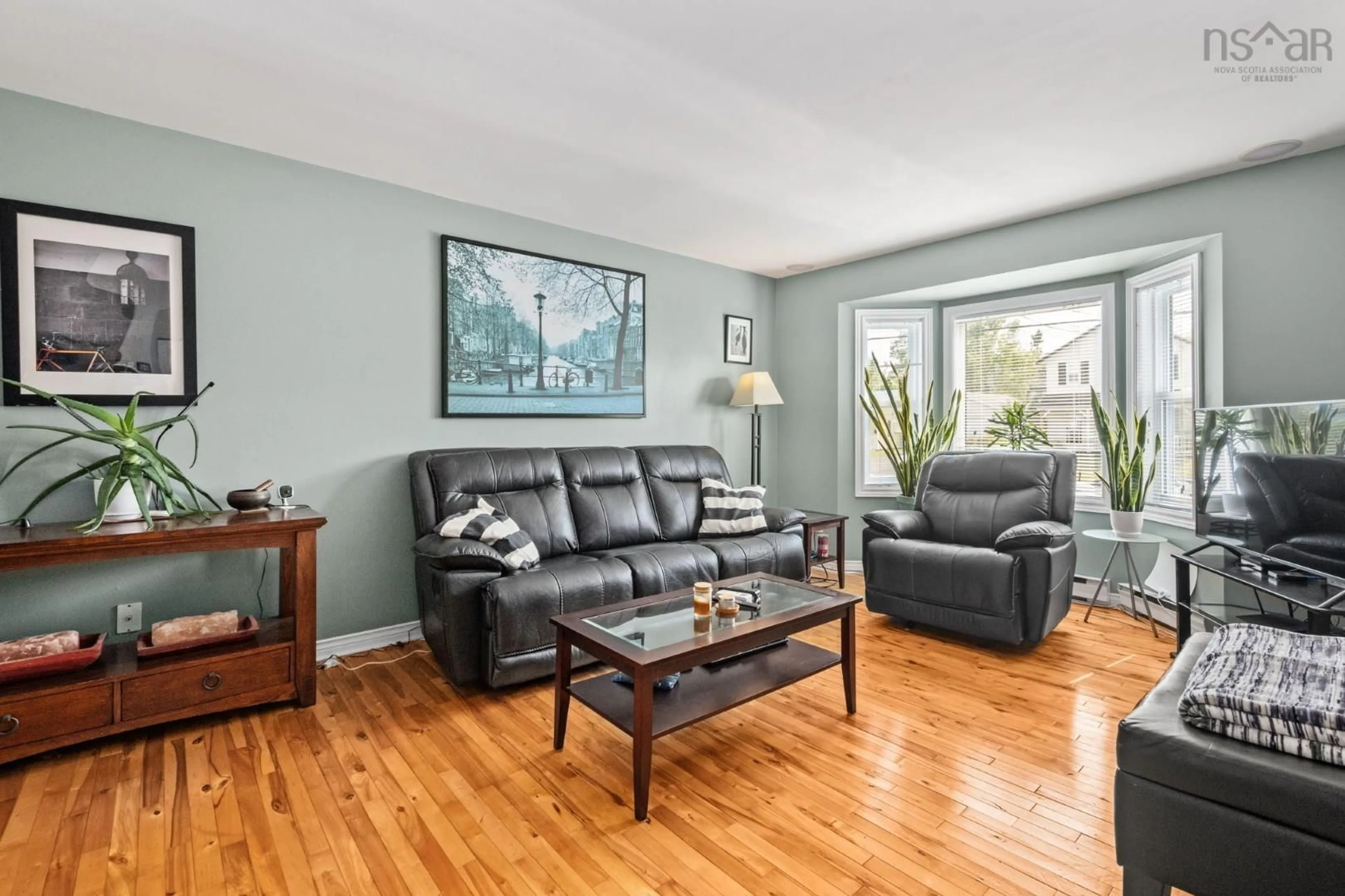 Living room with furniture, wood/laminate floor for 100 Governors Lake Rd, Timberlea Nova Scotia B3T 1A4
