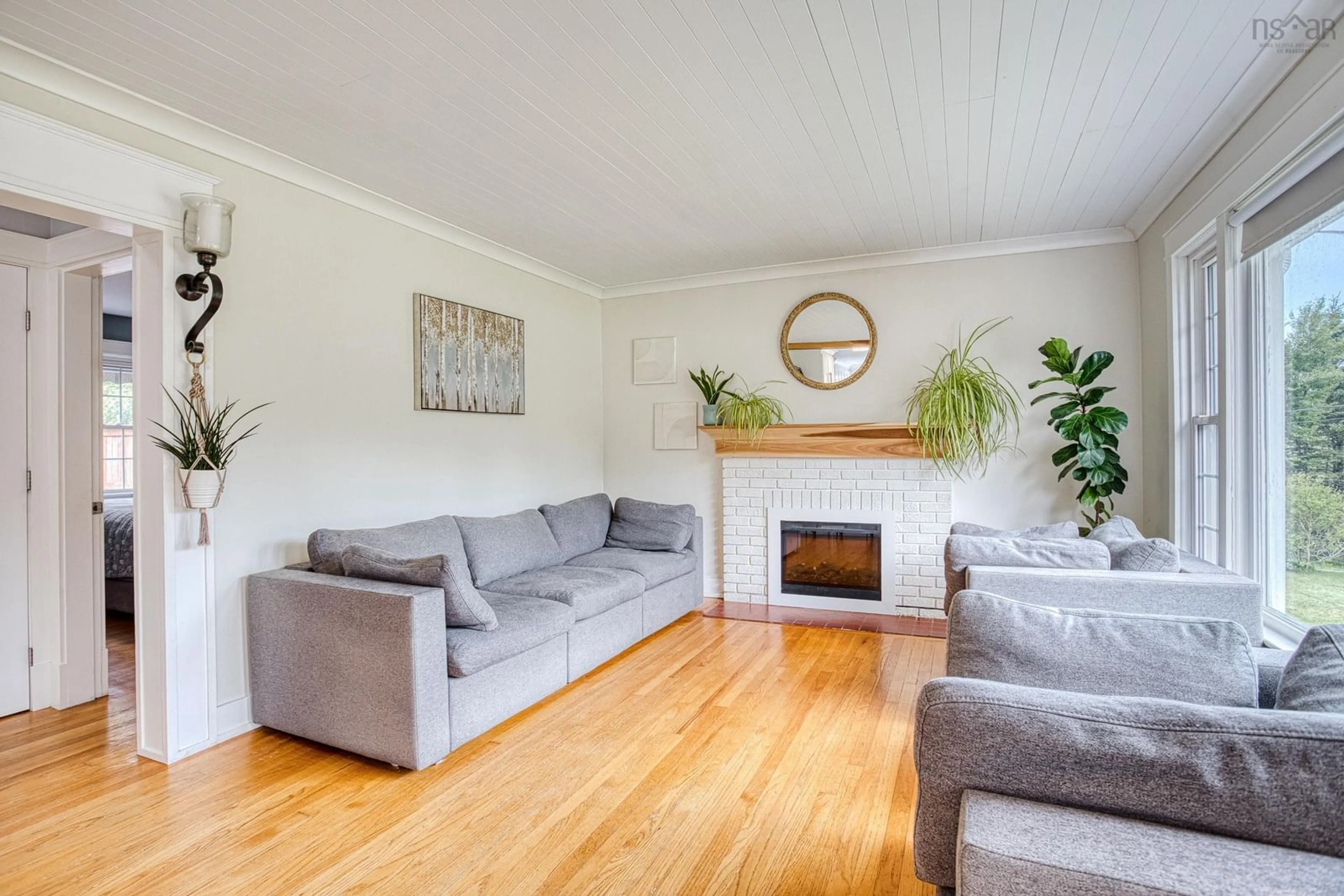 Living room with furniture, wood/laminate floor for 286 Patton Rd, Upper Sackville Nova Scotia B4E 3C1