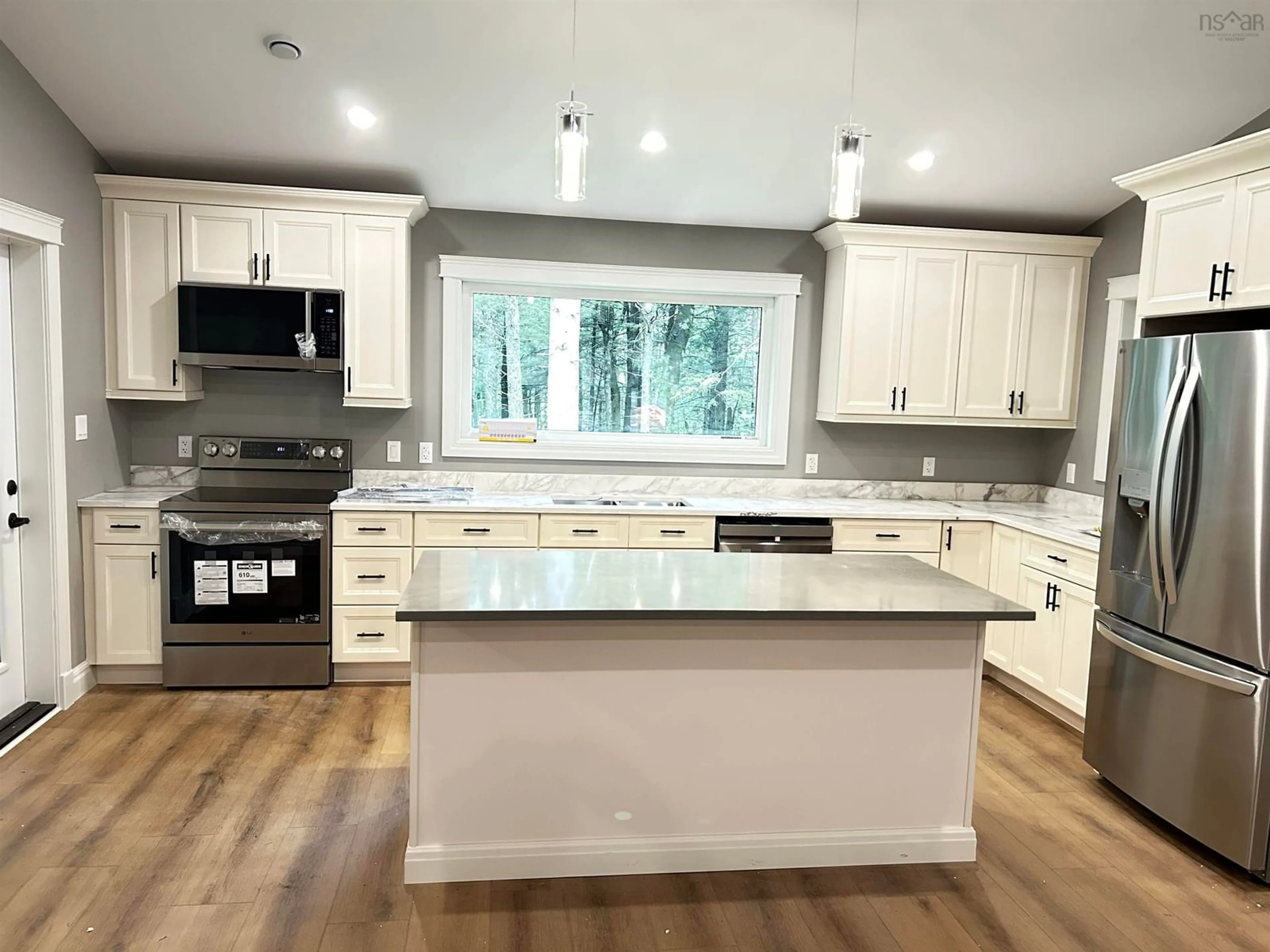 Open concept kitchen, wood/laminate floor for 2431 Highway 202, Gore Nova Scotia B0W 2N0