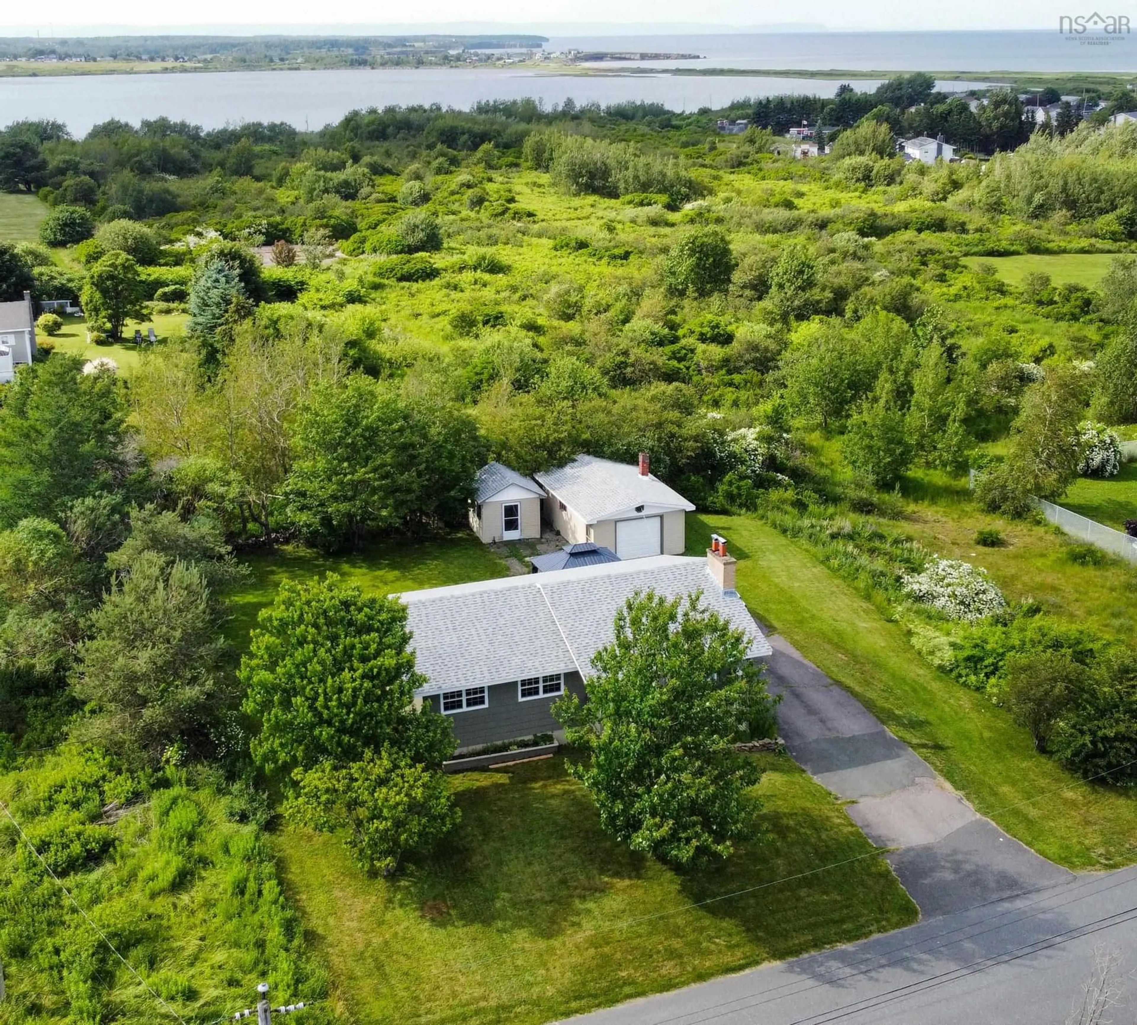 A pic from outside/outdoor area/front of a property/back of a property/a pic from drone, water/lake/river/ocean view for 19 Mcgean St, Sydney Mines Nova Scotia B1V 2A2