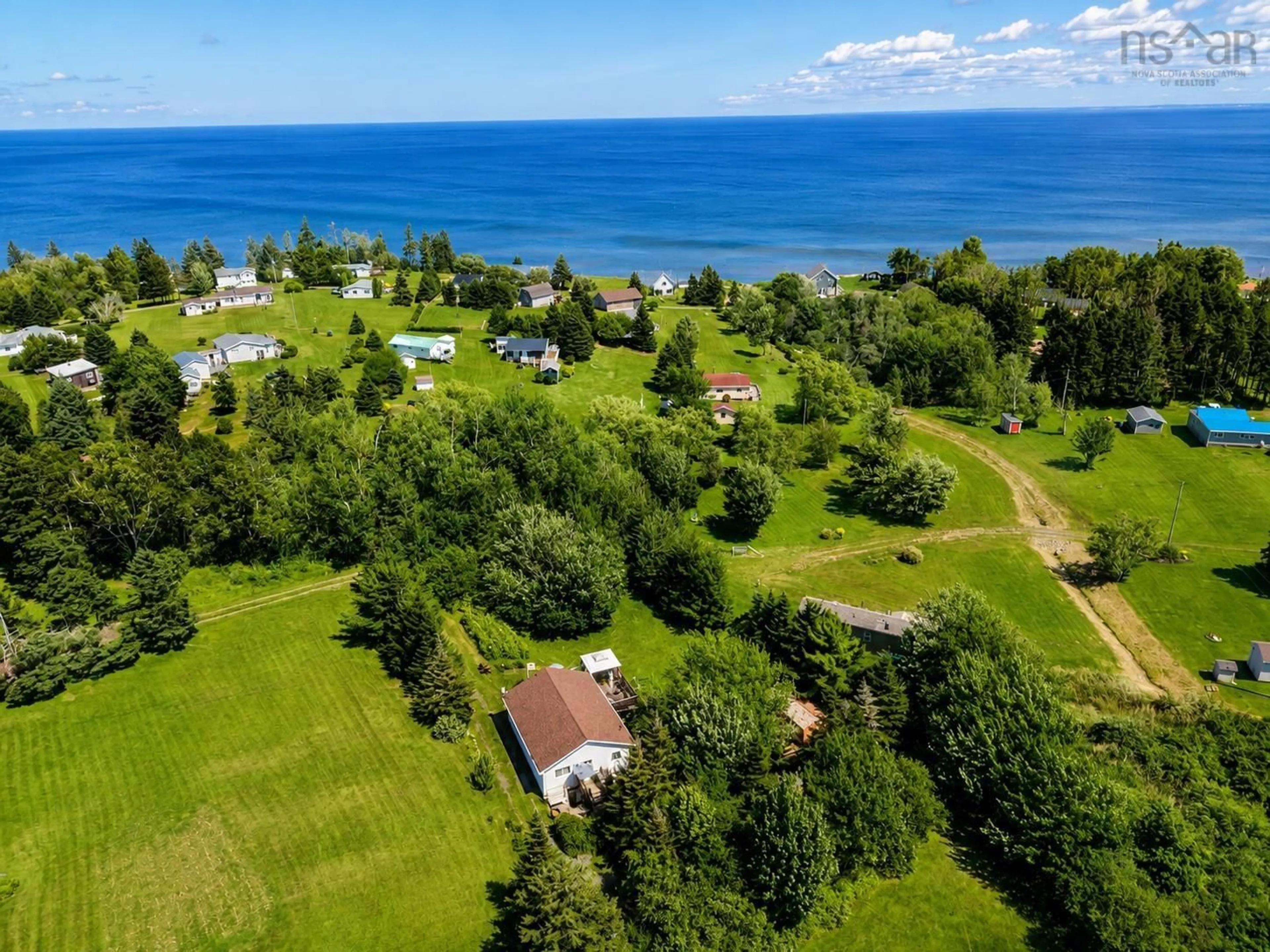 A pic from outside/outdoor area/front of a property/back of a property/a pic from drone, water/lake/river/ocean view for 36 Brownell Lane, Amherst Shore Nova Scotia B0L 1E0