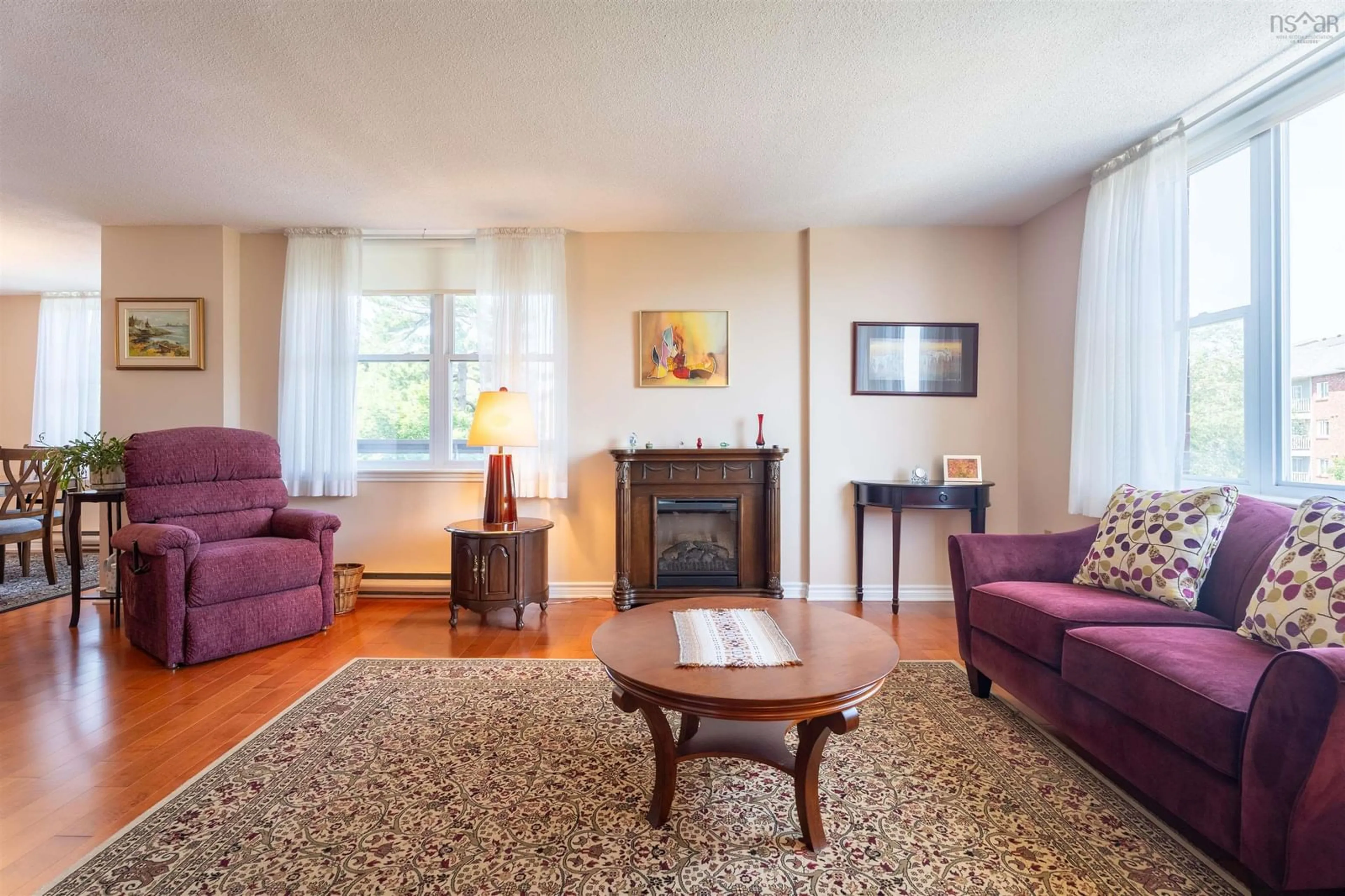 Living room with furniture, wood/laminate floor for 85 Spinnaker Dr #503, Halifax Nova Scotia B3N 3E3