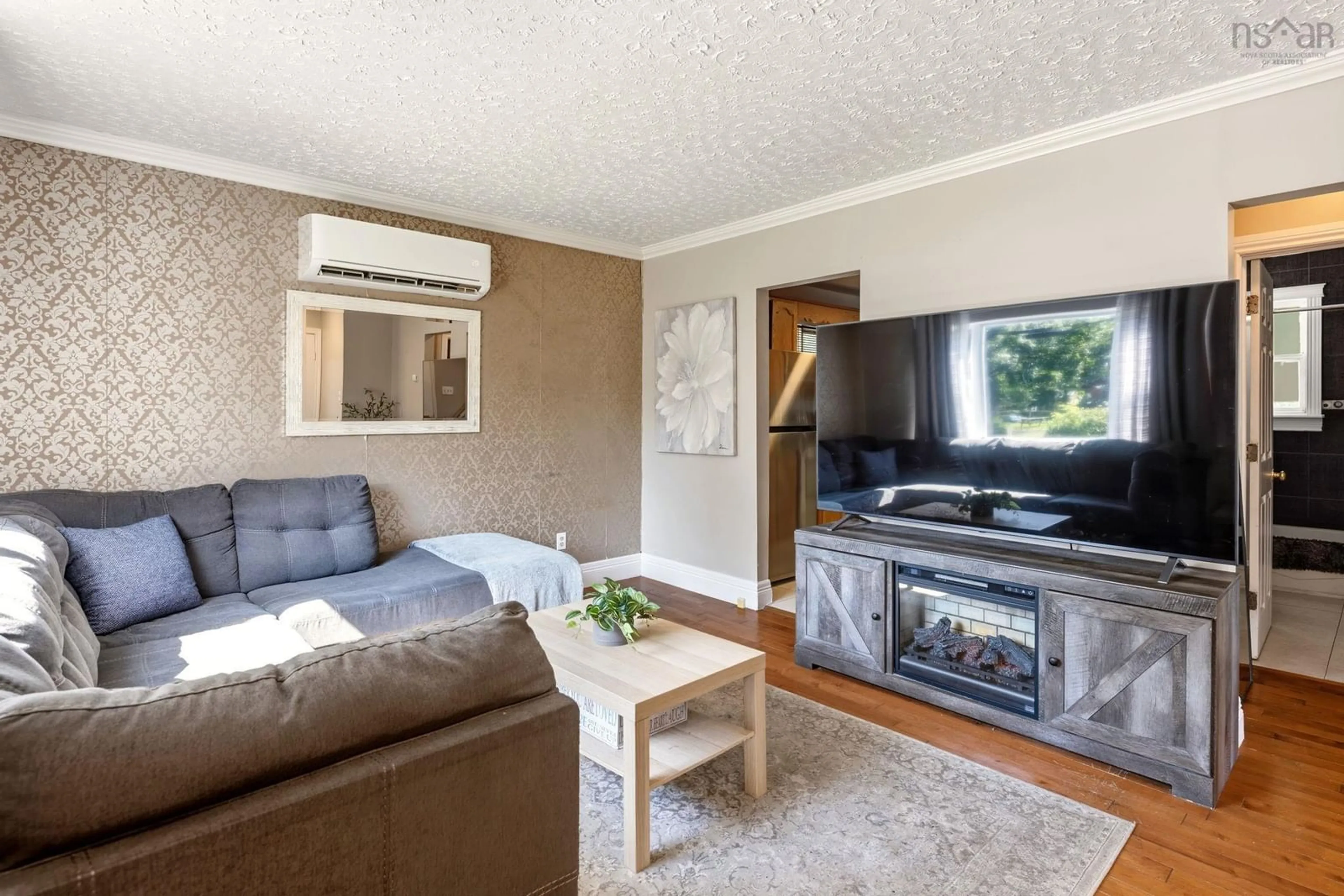 Living room with furniture, wood/laminate floor for 75 Courtney Rd, Dartmouth Nova Scotia B3A 4C3
