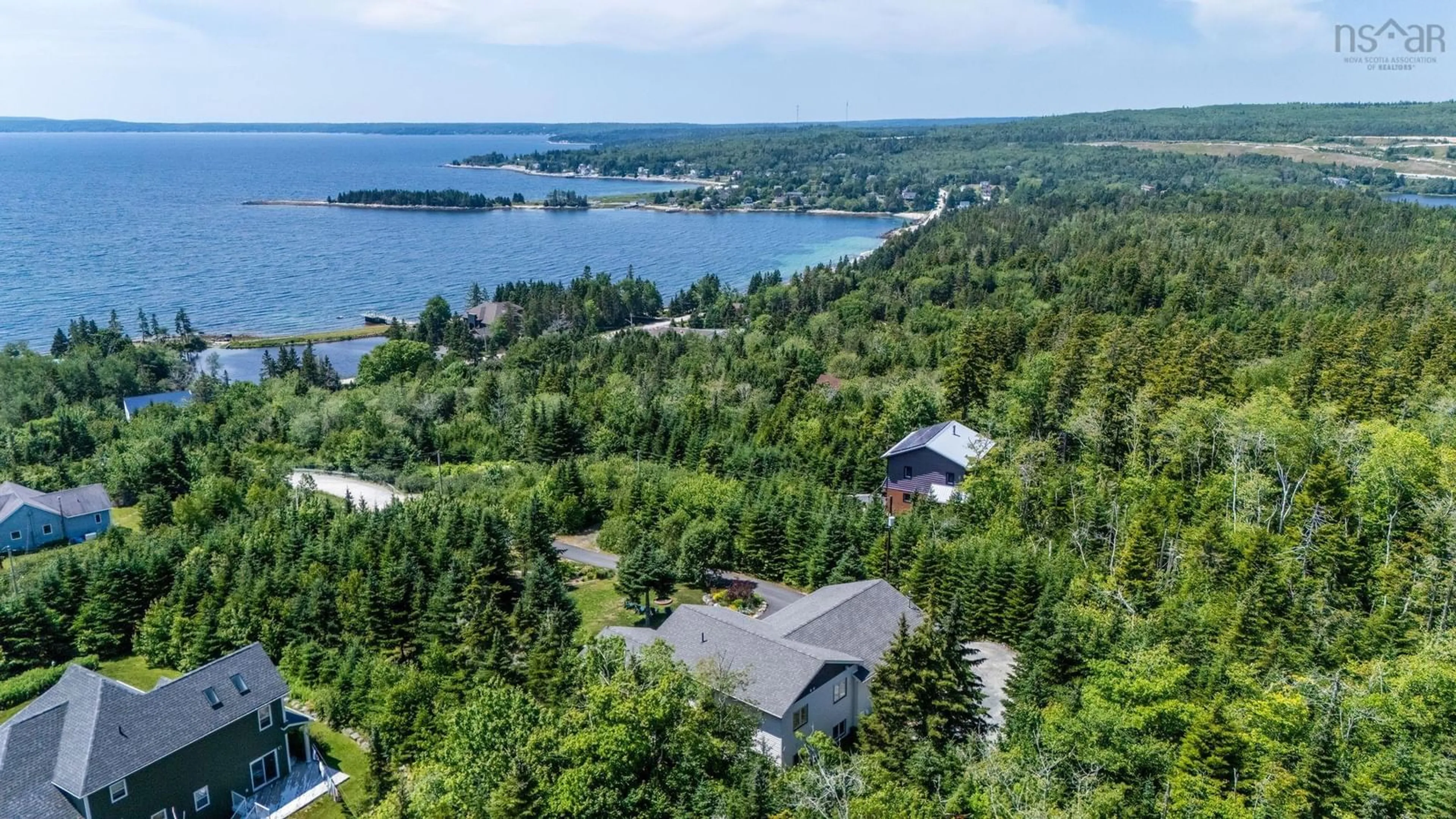 A pic from outside/outdoor area/front of a property/back of a property/a pic from drone, water/lake/river/ocean view for 116 Whitecap Ridge, Black Point Nova Scotia B0J 1T0