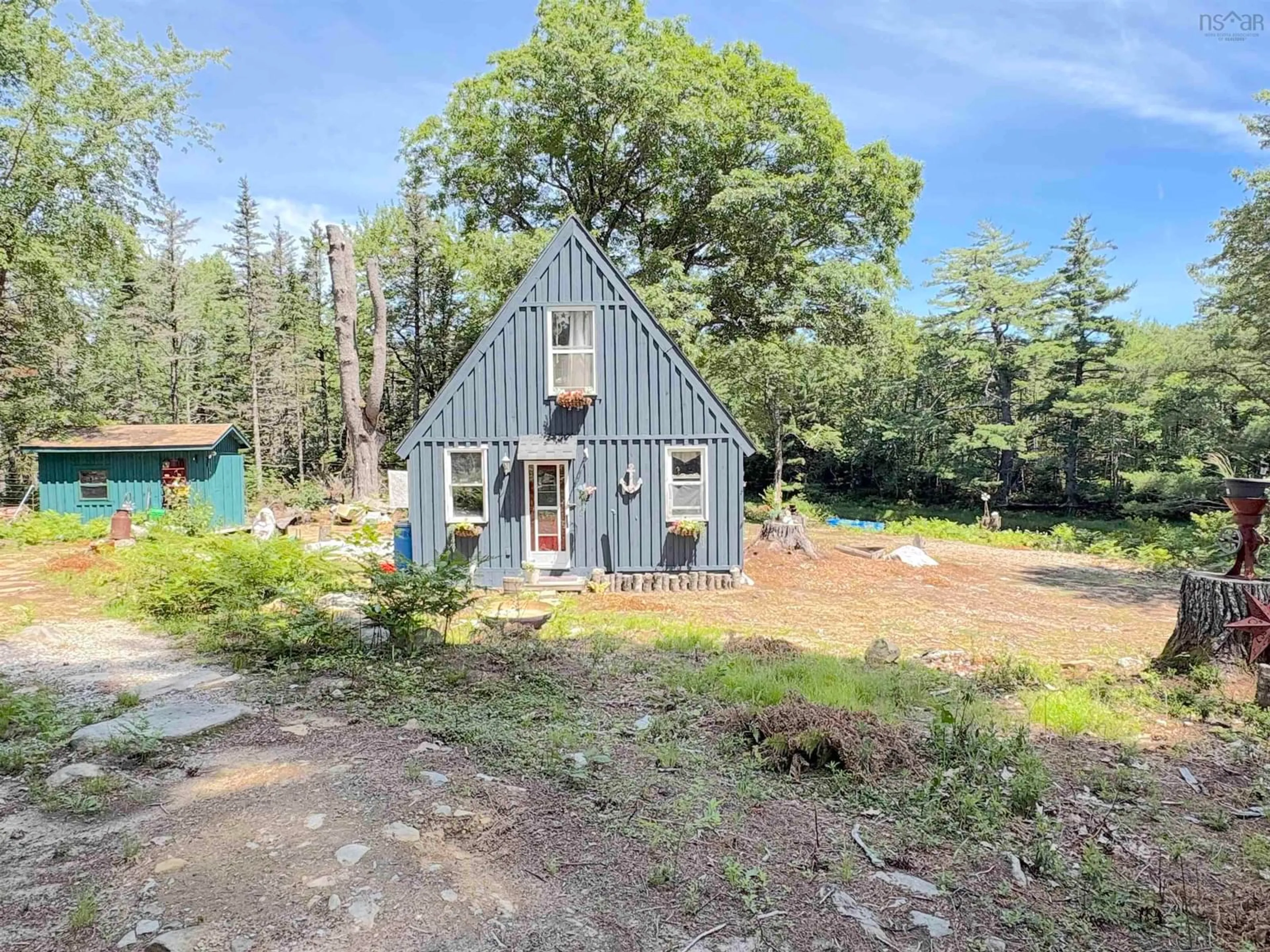 A pic from outside/outdoor area/front of a property/back of a property/a pic from drone, forest/trees view for 1894 Highway 103, Sable River Nova Scotia B0T 1V0