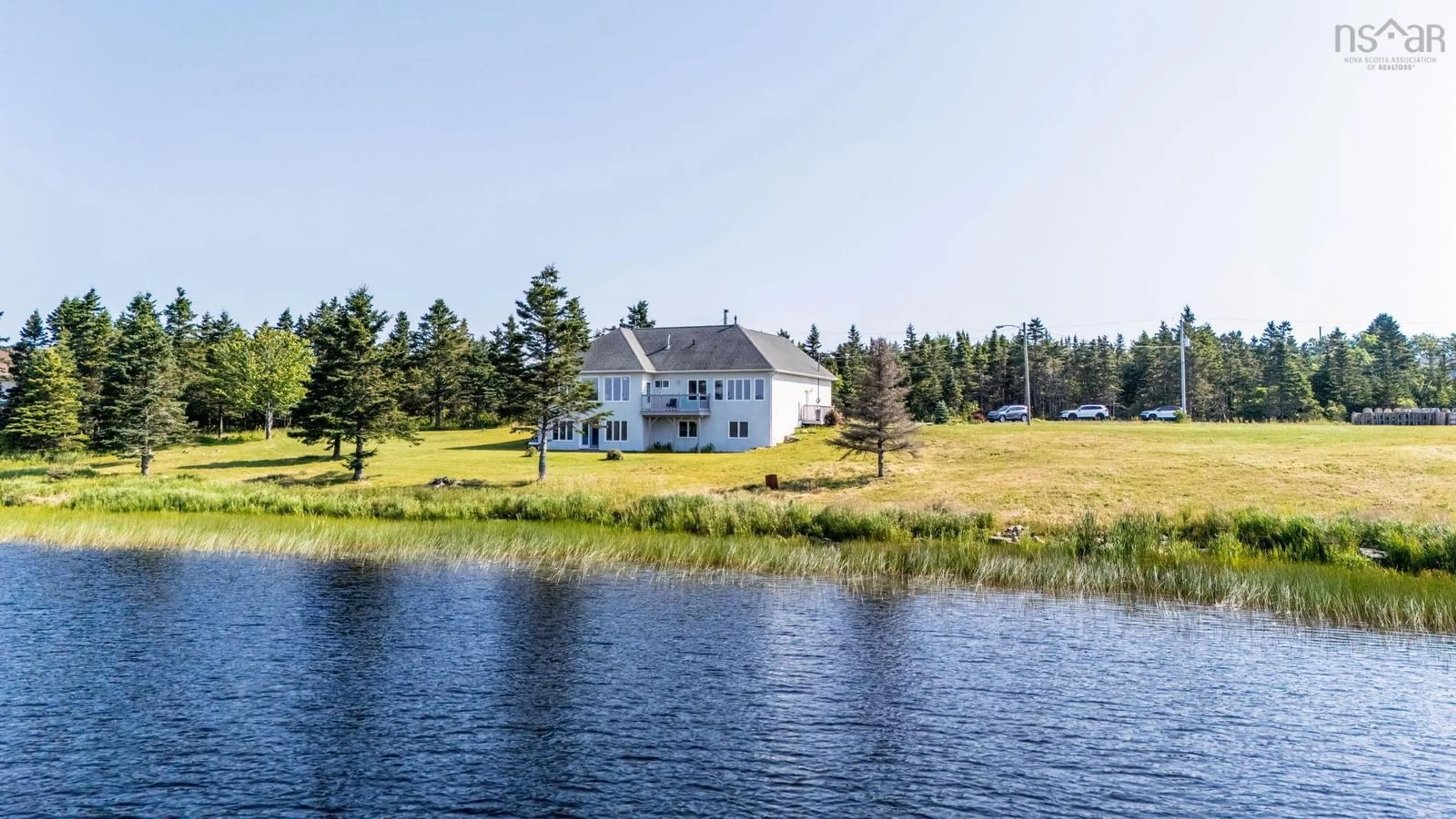 A pic from outside/outdoor area/front of a property/back of a property/a pic from drone, water/lake/river/ocean view for 1480 Cow Bay Road, Cow Bay Nova Scotia B3G 1L3