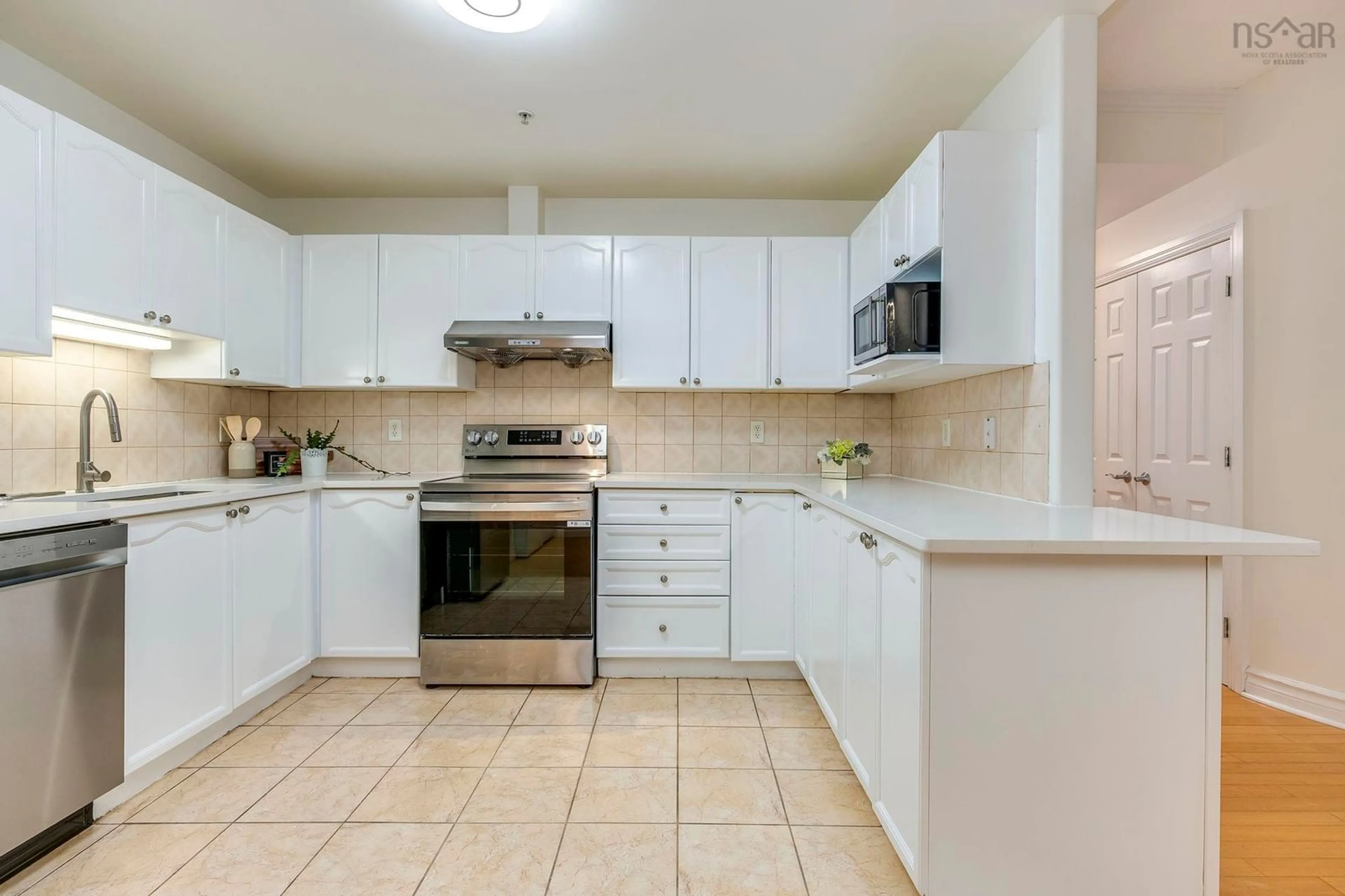 Standard kitchen, ceramic/tile floor for 116 Larry Uteck Blvd ##207, Halifax Nova Scotia B3M 4Y1