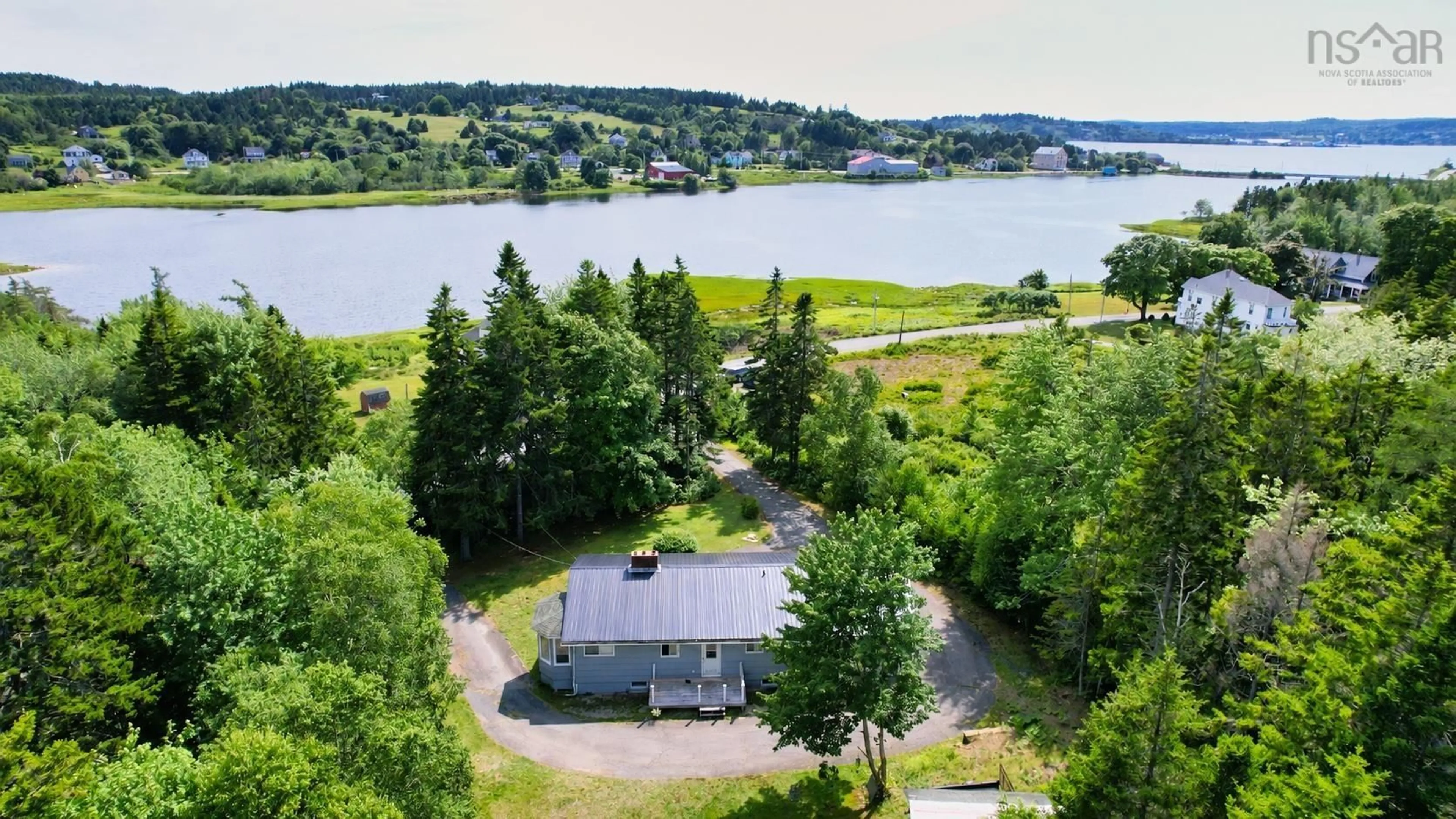 A pic from outside/outdoor area/front of a property/back of a property/a pic from drone, water/lake/river/ocean view for 120 North Side Rd, Riverport Nova Scotia B0J 2W0