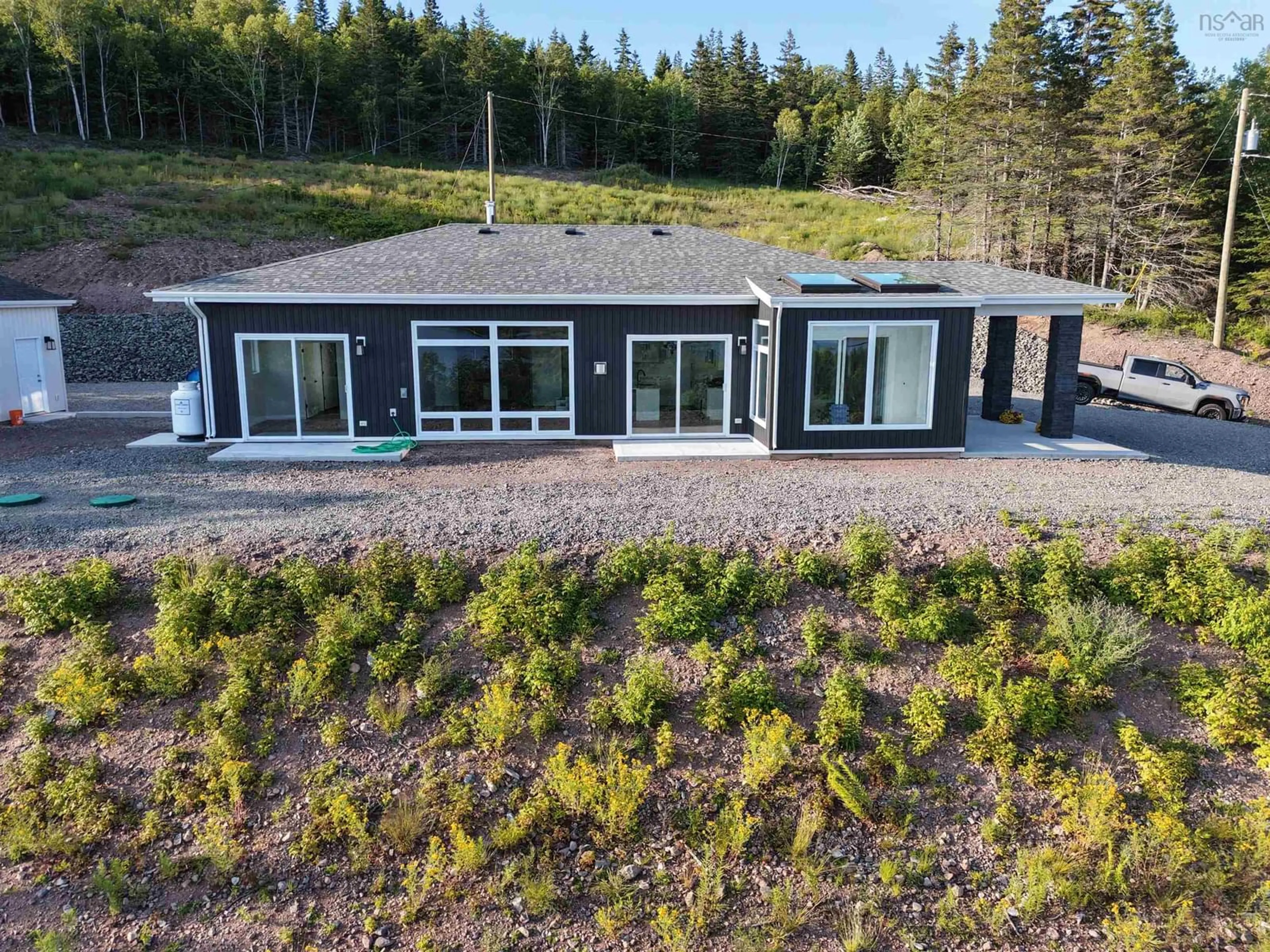 A pic from outside/outdoor area/front of a property/back of a property/a pic from drone, forest/trees view for 3352 Eskasoni Road, Islandview Nova Scotia B1J 1K3