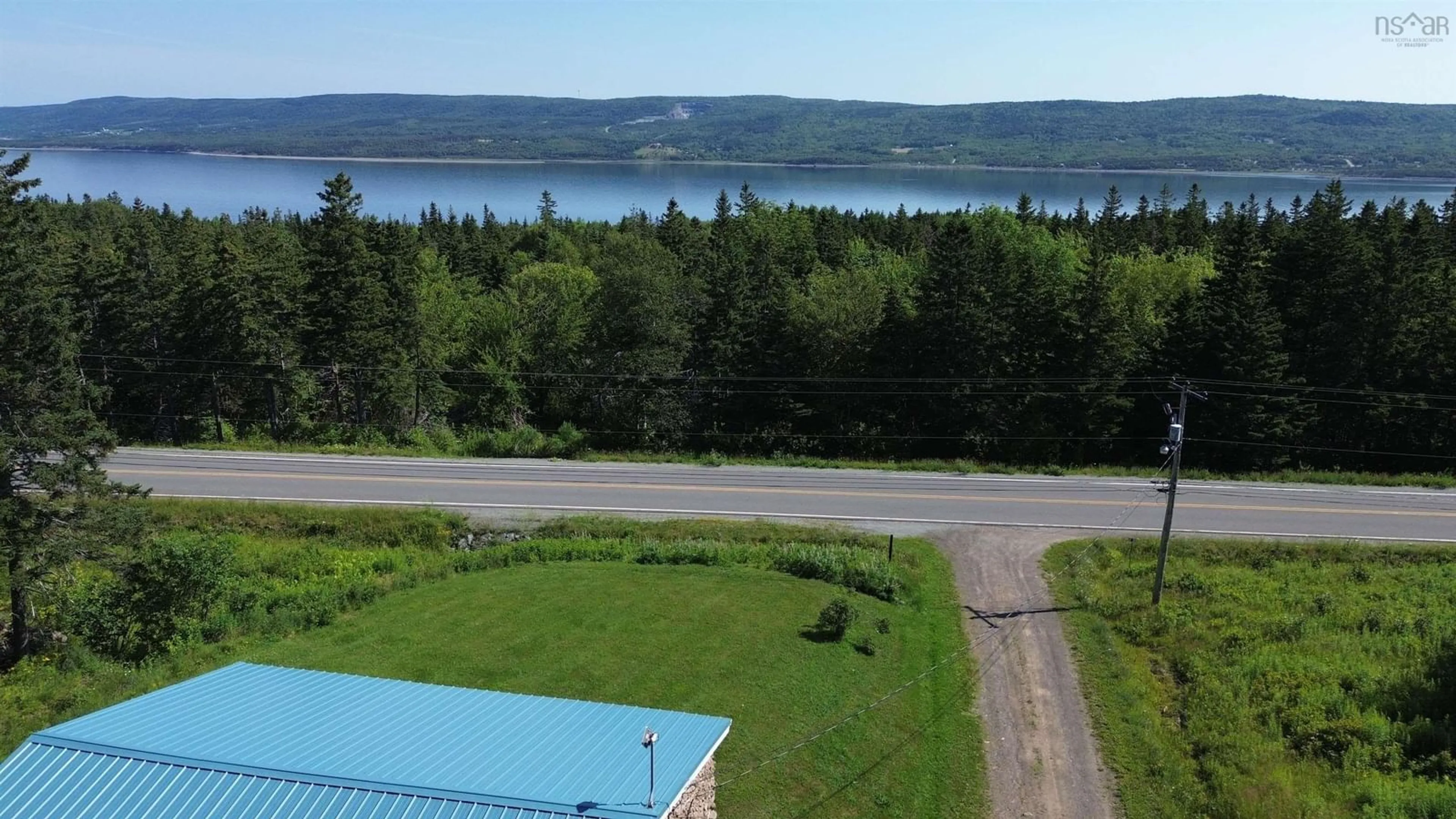 A pic from outside/outdoor area/front of a property/back of a property/a pic from drone, water/lake/river/ocean view for 13628 Hwy 4, Aulds Cove Nova Scotia B0H 1P0