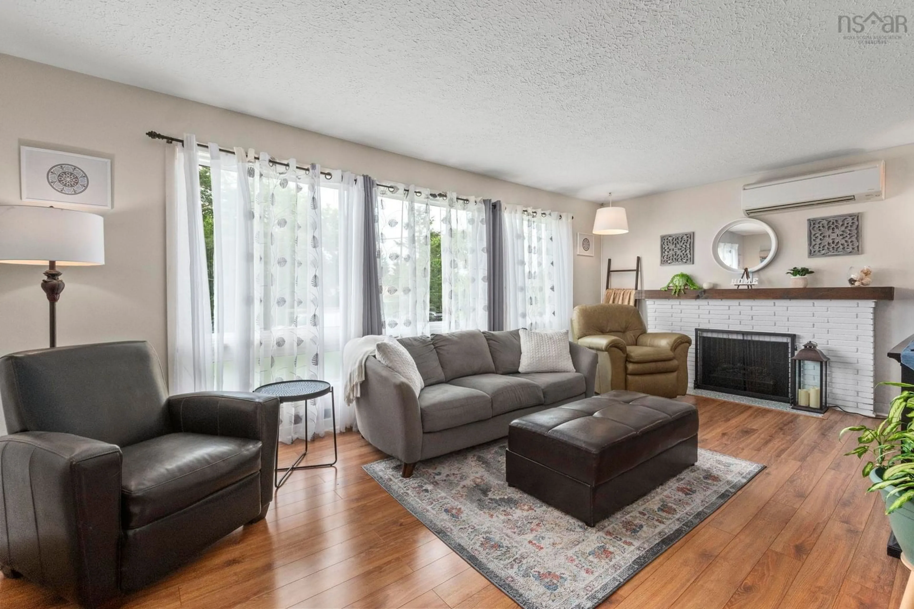 Living room with furniture, wood/laminate floor for 16 Wedgewood Ave, Timberlea Nova Scotia B3T 1E7