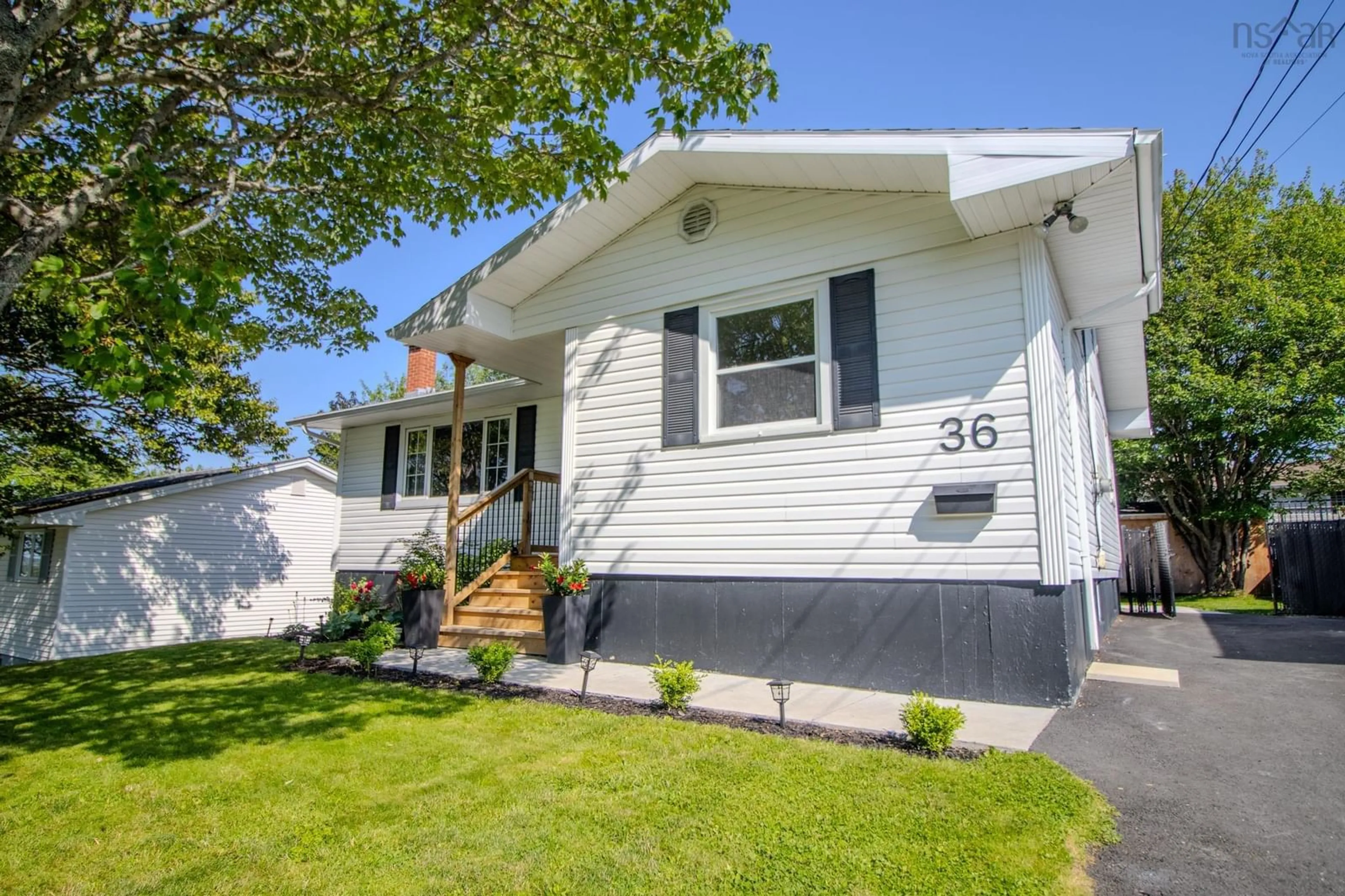 Home with vinyl exterior material, street for 36 Common St, Sydney Nova Scotia B1P 3L1