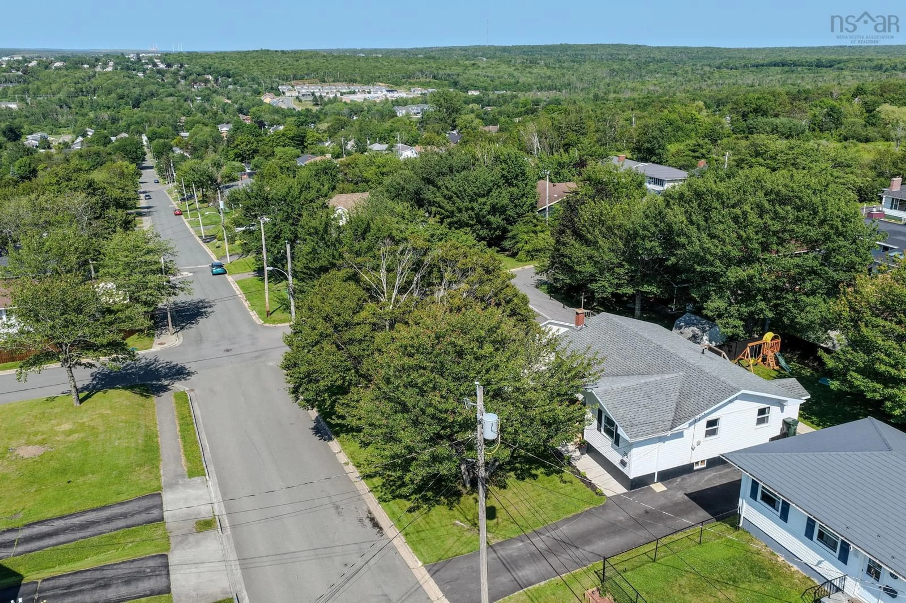 A pic from outside/outdoor area/front of a property/back of a property/a pic from drone, street for 36 Common St, Sydney Nova Scotia B1P 3L1