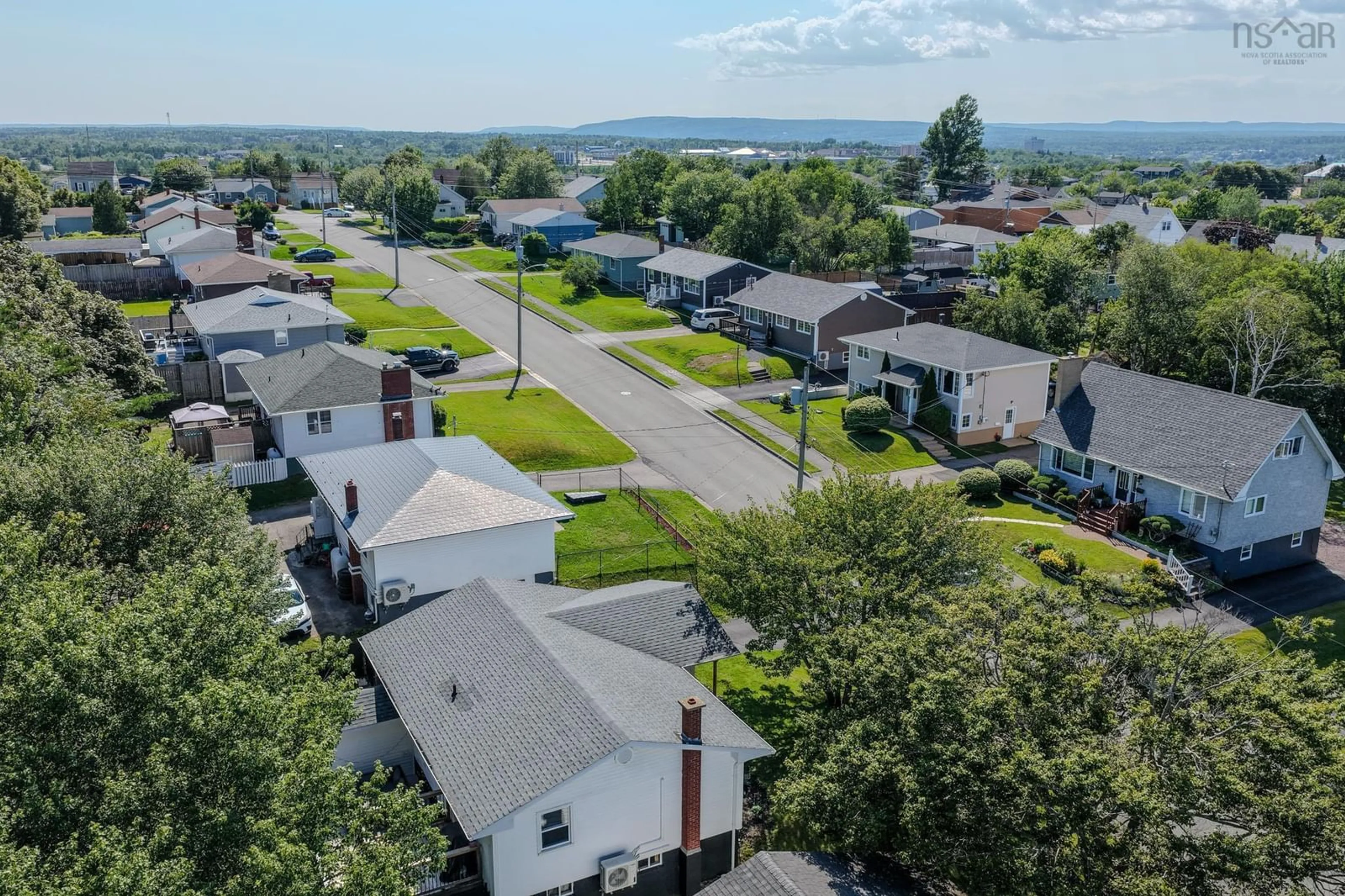 A pic from outside/outdoor area/front of a property/back of a property/a pic from drone, unknown for 36 Common St, Sydney Nova Scotia B1P 3L1