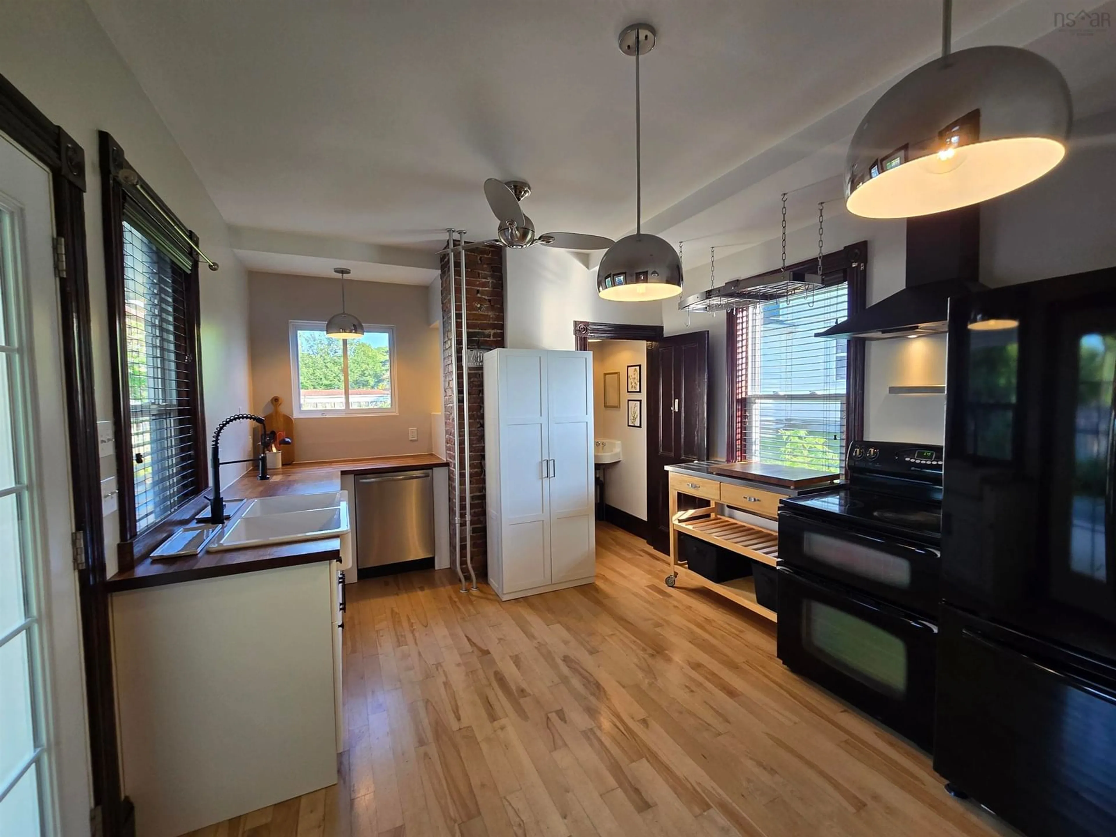 Open concept kitchen, wood/laminate floor for 59 Argyle St, Sydney Nova Scotia B1S 2V1