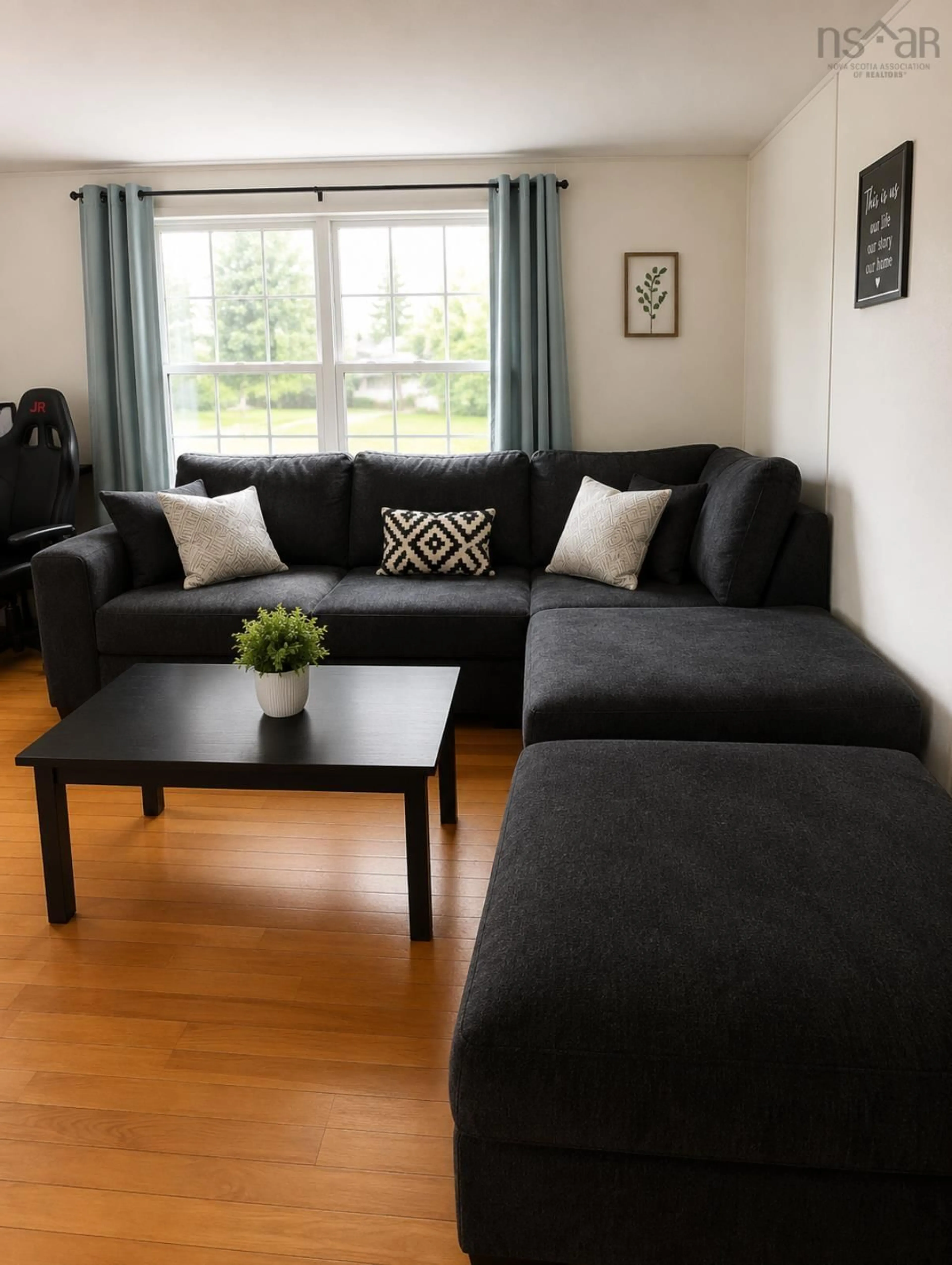 Living room with furniture, wood/laminate floor for 1001 Evans Way, Westville Nova Scotia B0K 2A0