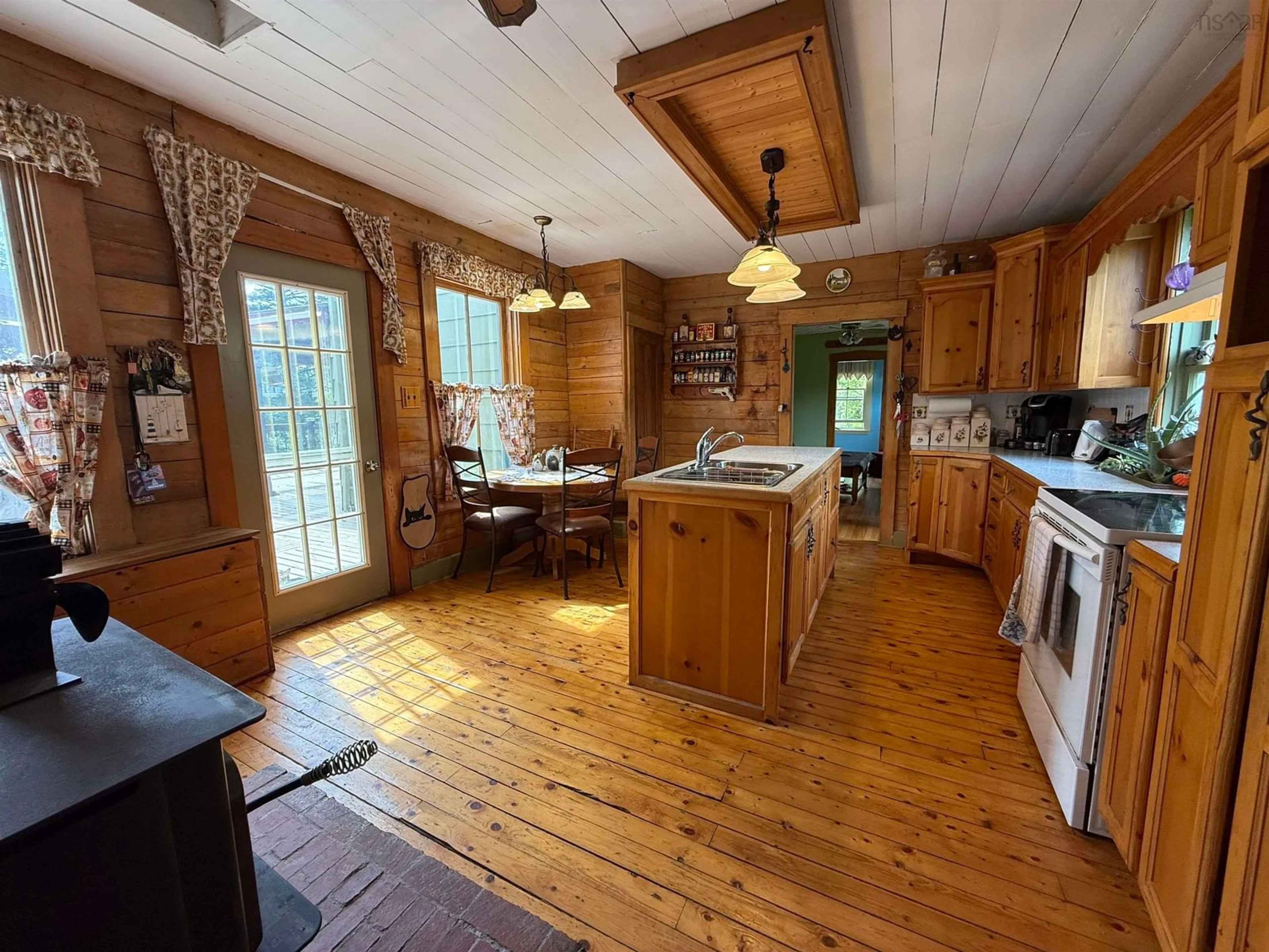 Open concept kitchen, wood/laminate floor for 22 Hogg Lane, Sheet Harbour Nova Scotia B0J 3B0