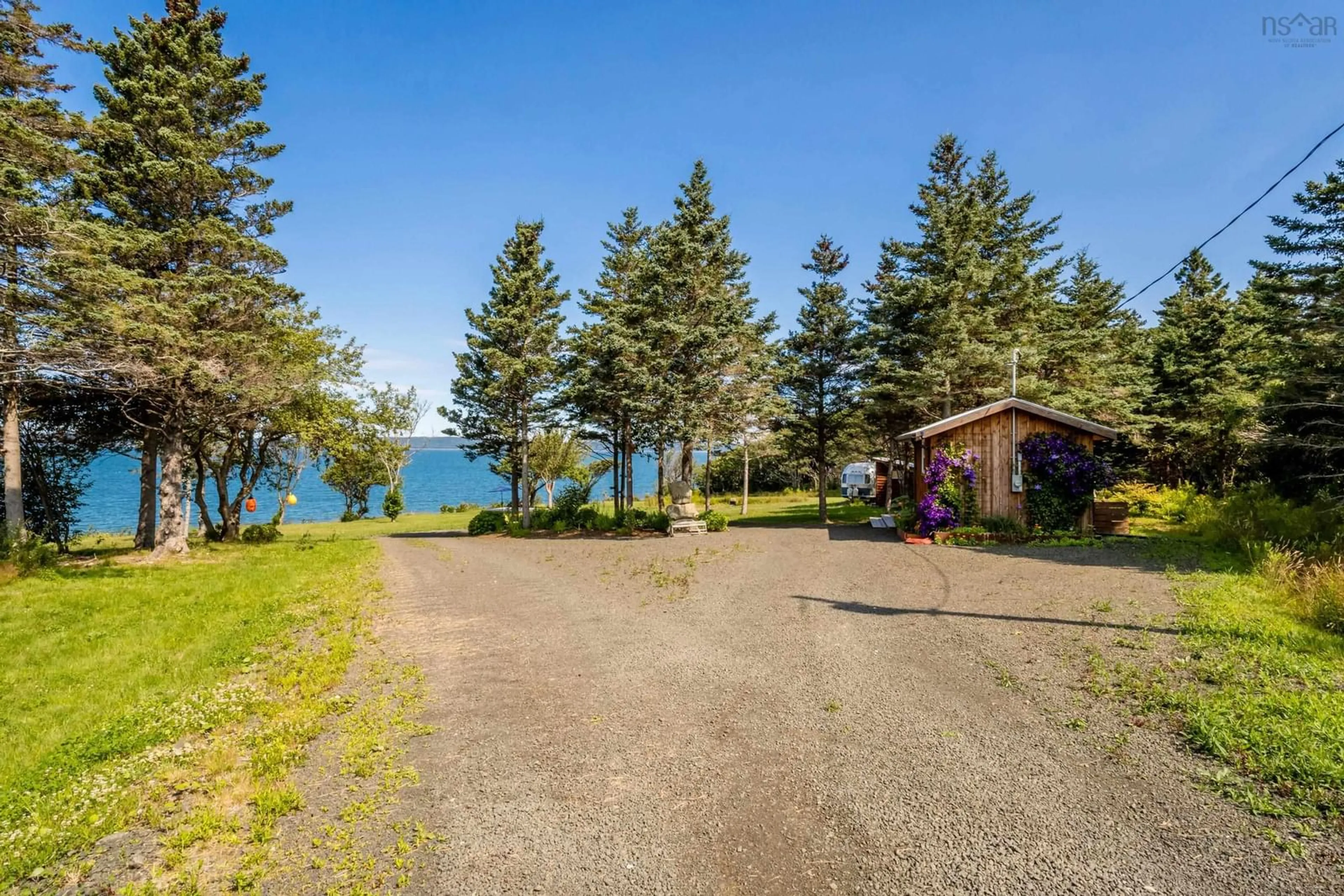 A pic from outside/outdoor area/front of a property/back of a property/a pic from drone, water/lake/river/ocean view for 6829 Highway 101, Gilberts Cove Nova Scotia B0W 2R0