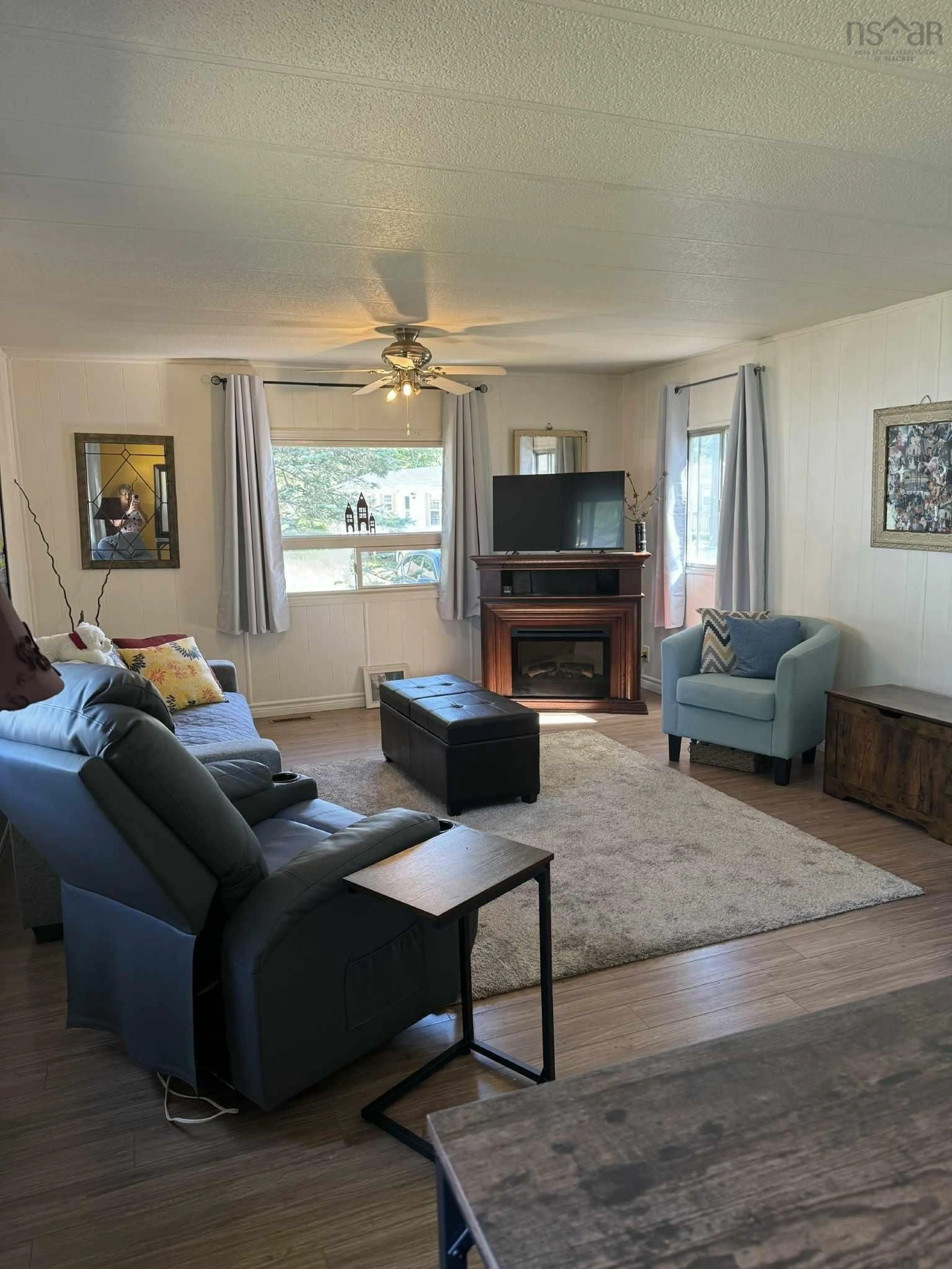 Living room with furniture, wood/laminate floor for 107 Olympic Ave, New Minas Nova Scotia B4N 3T7