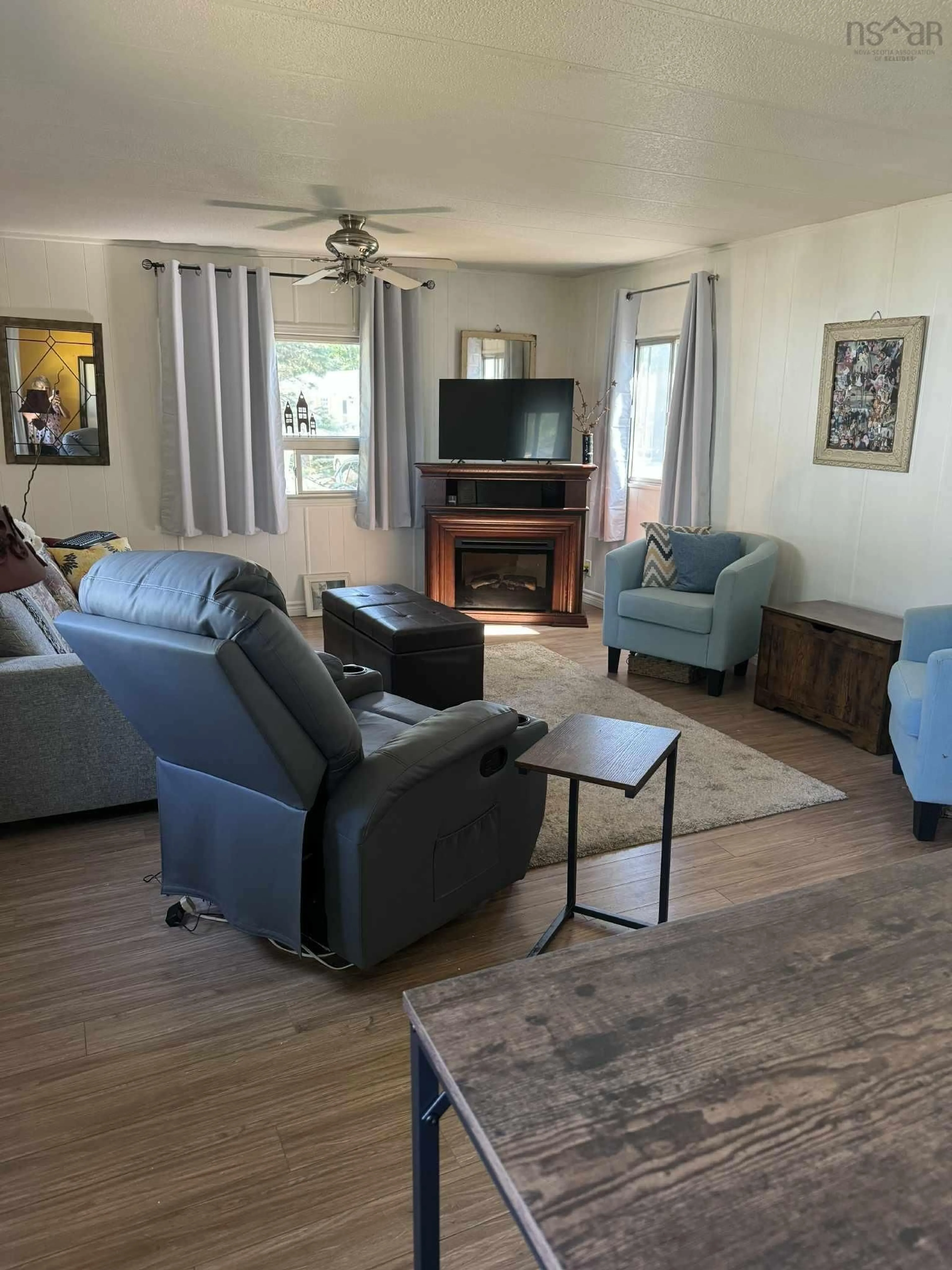 Living room with furniture, wood/laminate floor for 107 Olympic Ave, New Minas Nova Scotia B4N 3T7