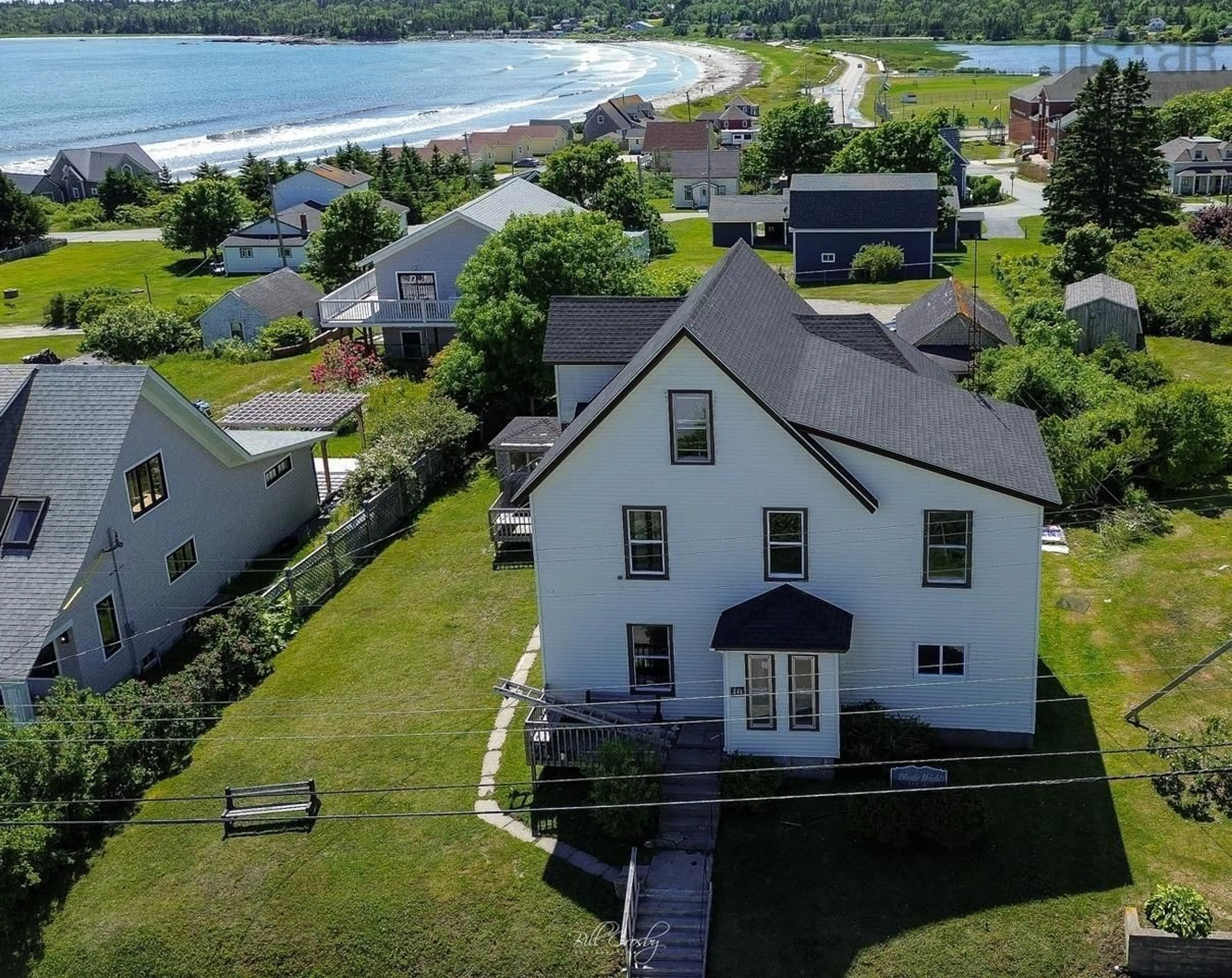 A pic from outside/outdoor area/front of a property/back of a property/a pic from drone, water/lake/river/ocean view for 19 Crest Street St, Lockeport Nova Scotia B0T 1L0