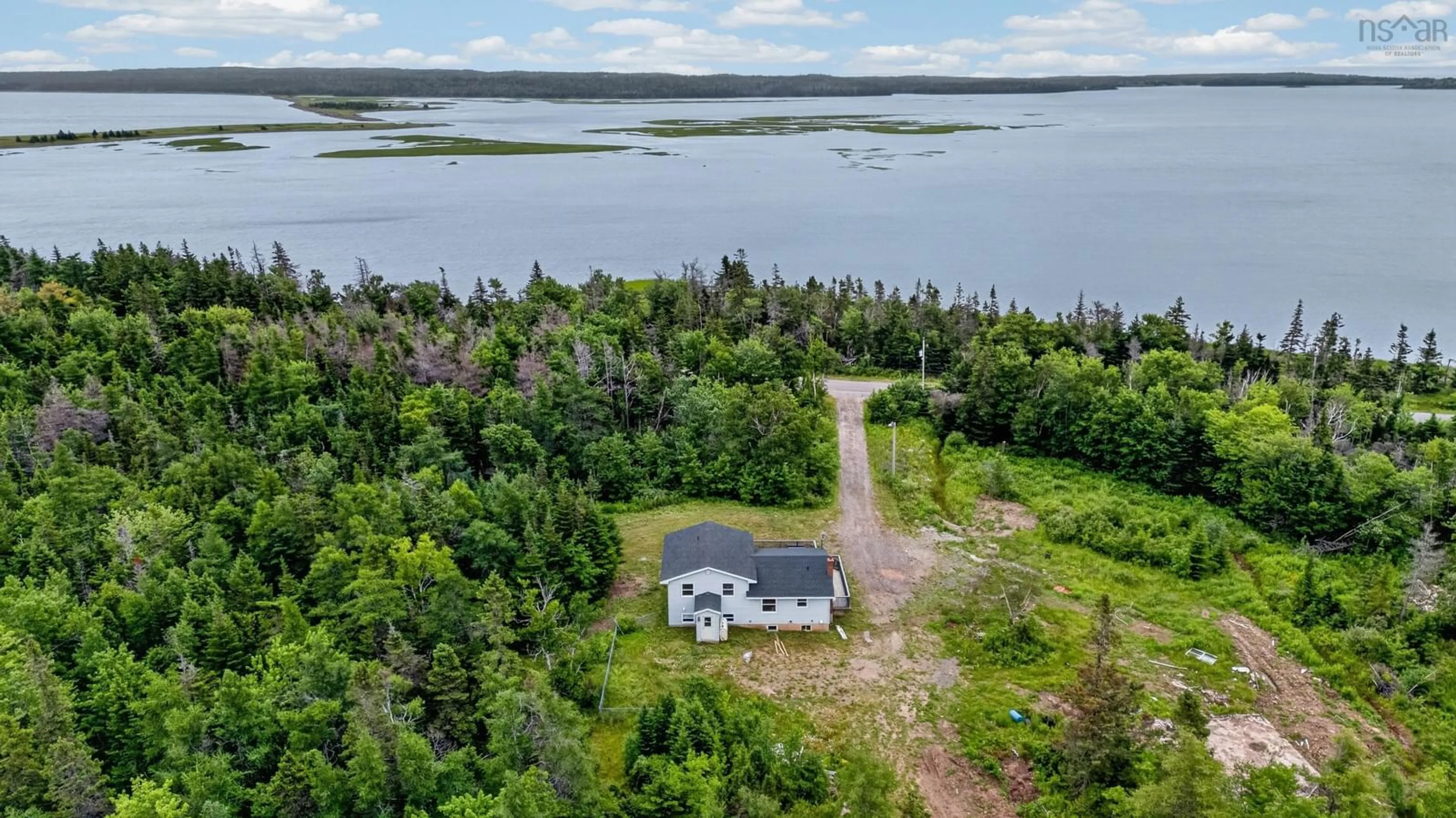 A pic from outside/outdoor area/front of a property/back of a property/a pic from drone, water/lake/river/ocean view for 3262 Highway 255 Hwy, Port Morien Nova Scotia B1B 1T9