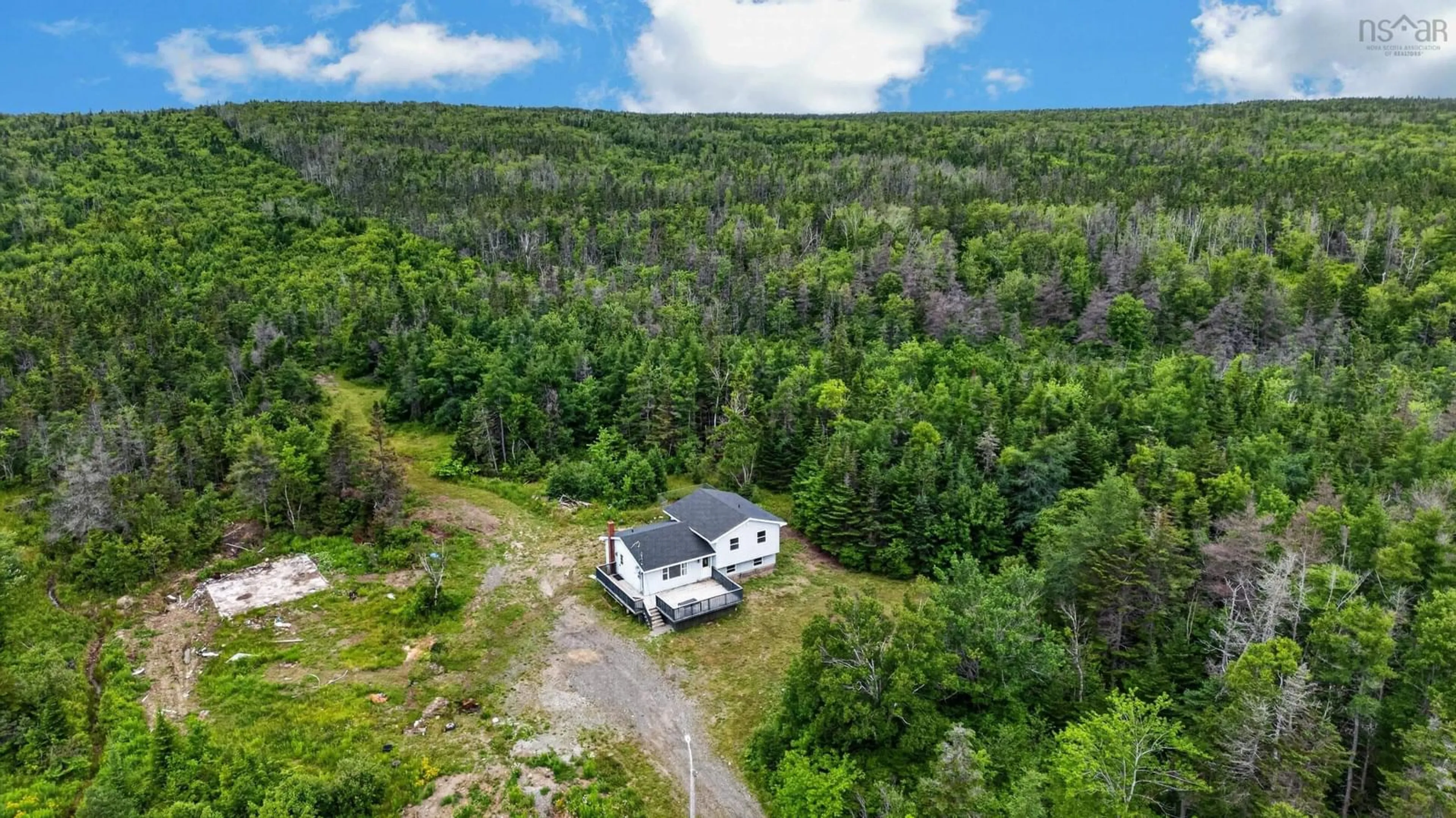 A pic from outside/outdoor area/front of a property/back of a property/a pic from drone, forest/trees view for 3262 Highway 255 Hwy, Port Morien Nova Scotia B1B 1T9