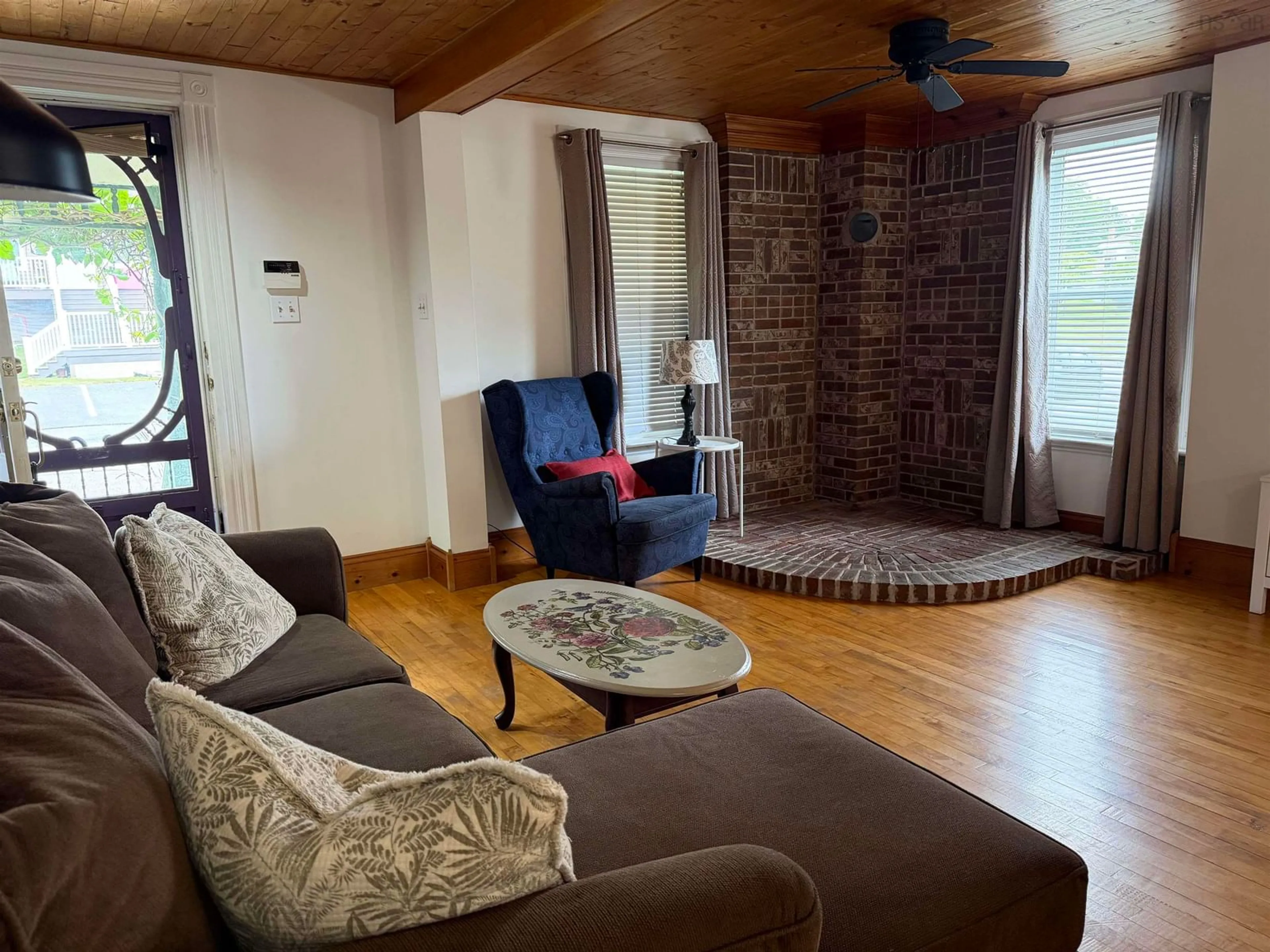 Living room with furniture, wood/laminate floor for 69 Alice St, Truro Nova Scotia B2N 2M8