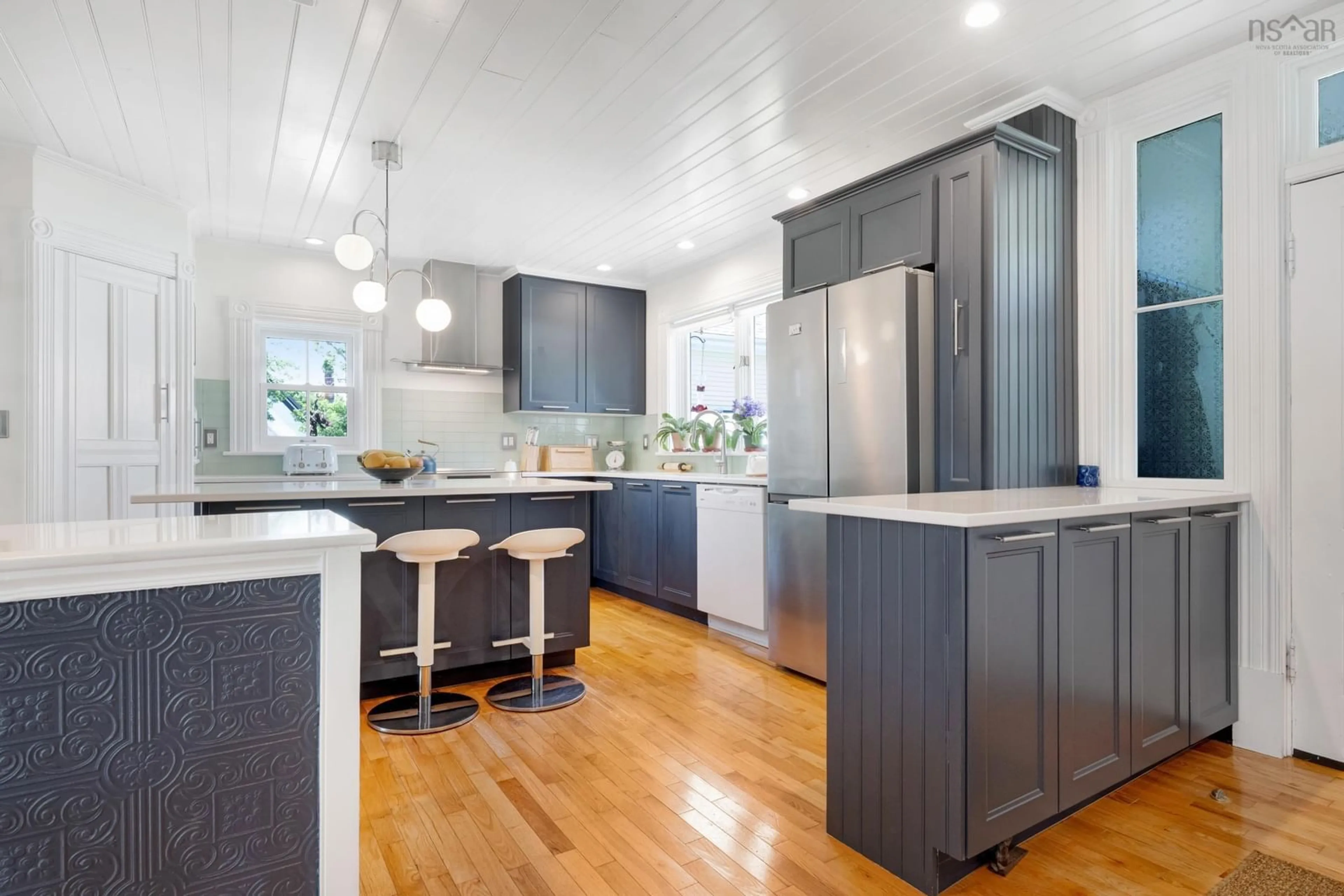 Open concept kitchen, wood/laminate floor for 129 Townsend St, Lunenburg Nova Scotia B0J 2C0
