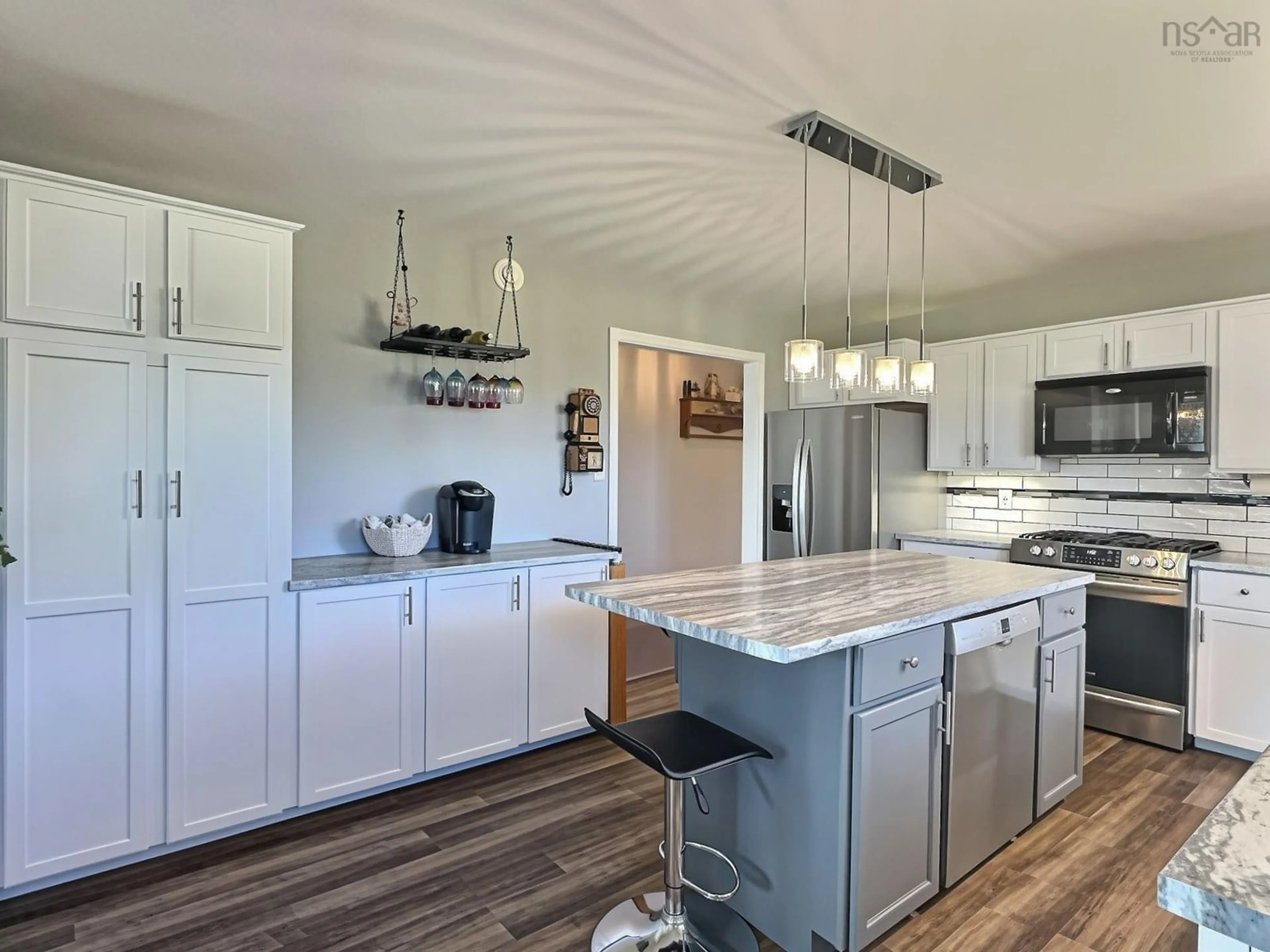 Open concept kitchen, wood/laminate floor for 14 Lower Harmony Rd, Harmony Nova Scotia B6L 3V6