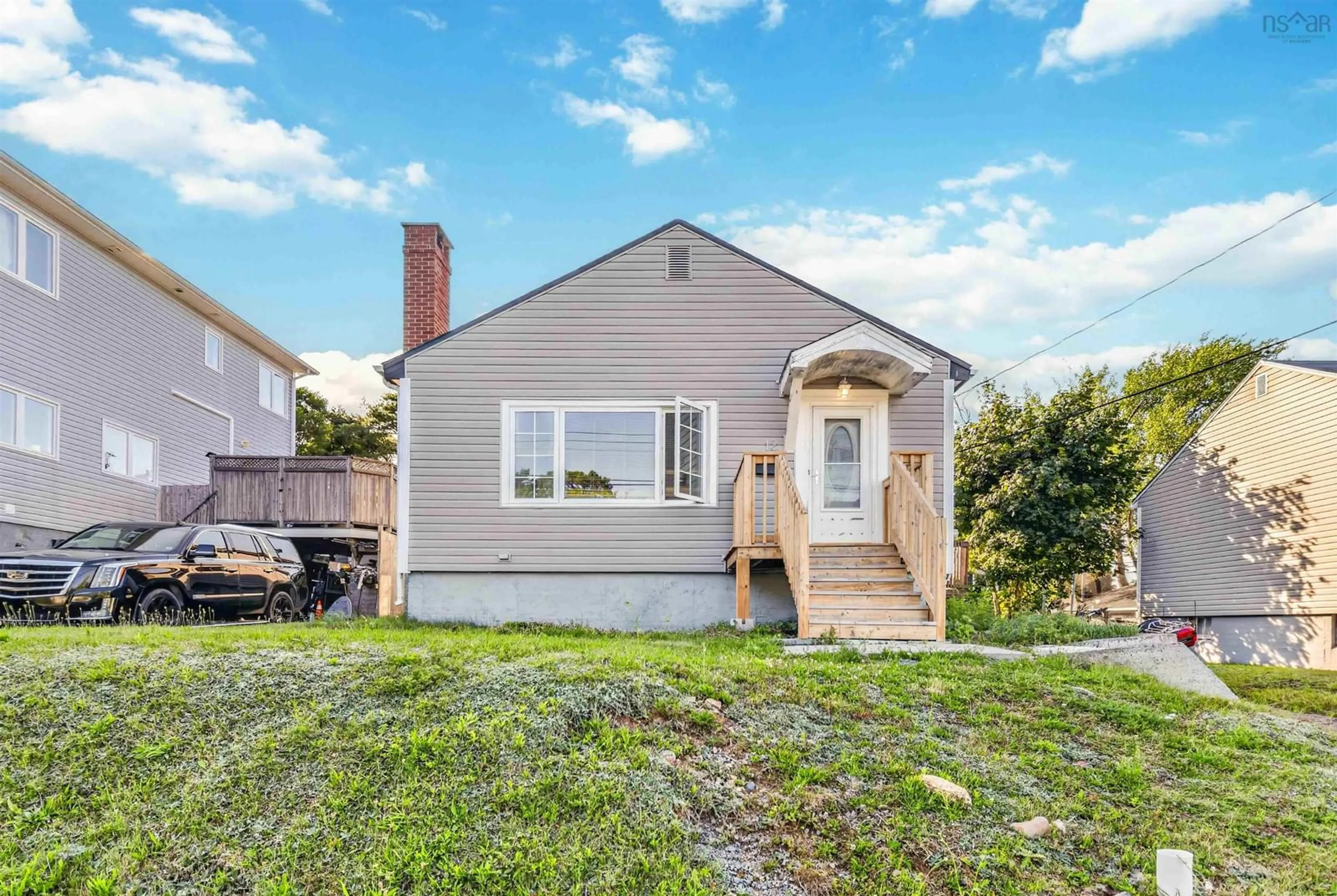 Home with vinyl exterior material, street for 12 Auburn Ave, Spryfield Nova Scotia B3R 1K4