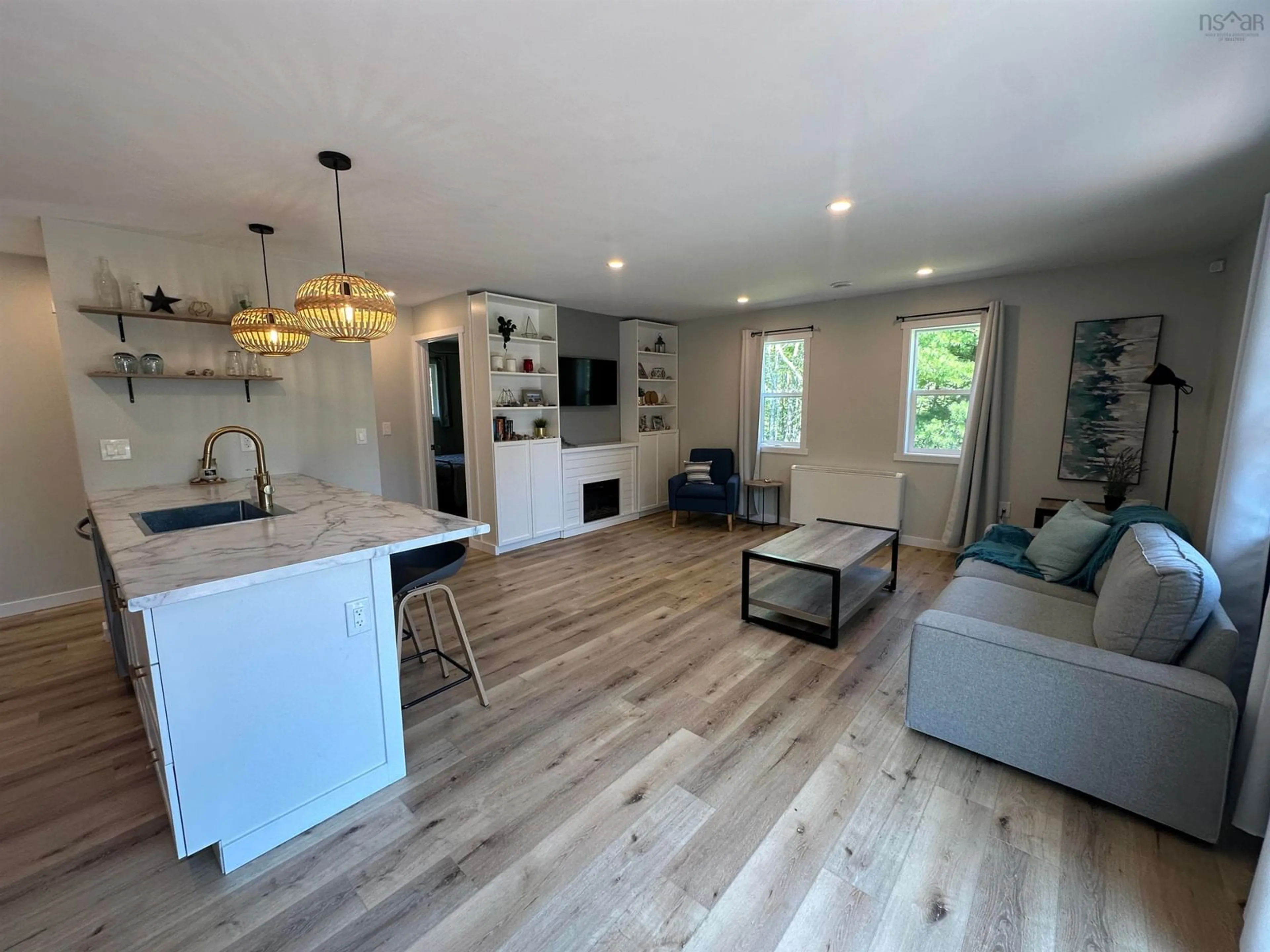 Open concept kitchen, wood/laminate floor for 76 Five Rivers Dr, White Point Nova Scotia B0T 1K0