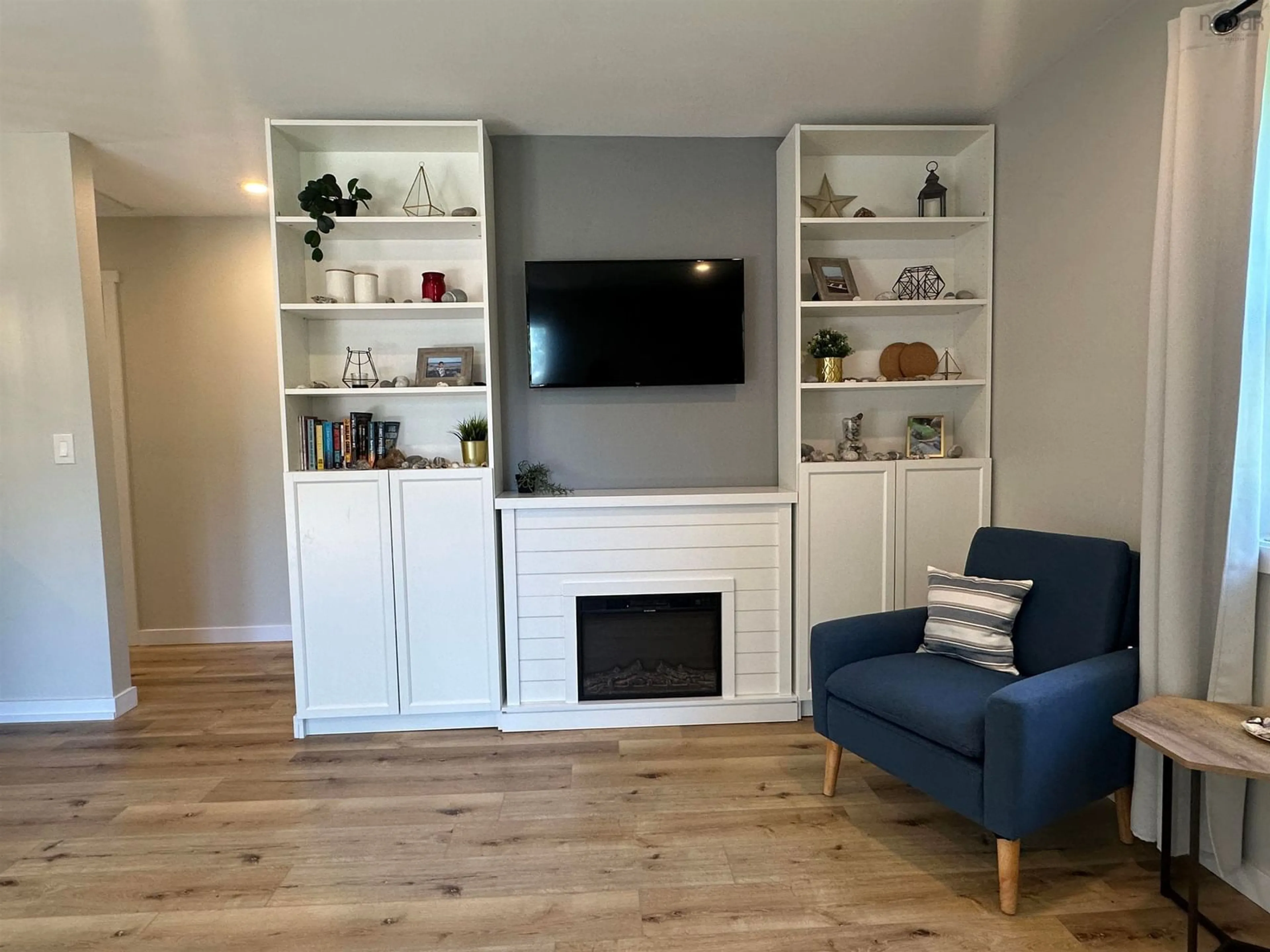 Living room with furniture, wood/laminate floor for 76 Five Rivers Dr, White Point Nova Scotia B0T 1K0