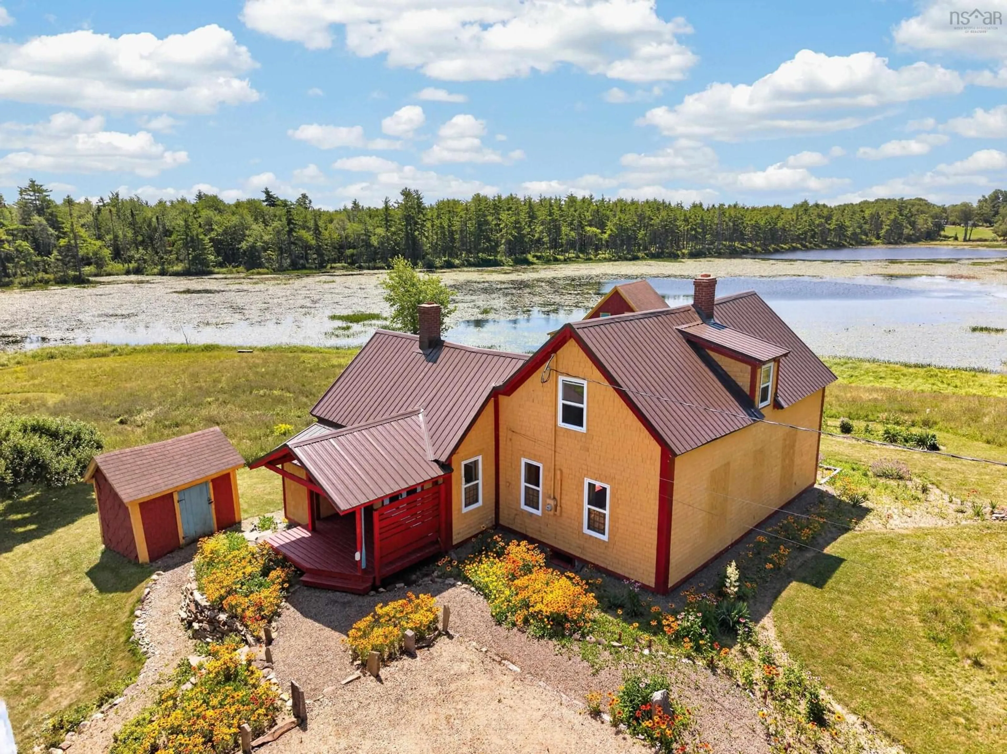 A pic from outside/outdoor area/front of a property/back of a property/a pic from drone, water/lake/river/ocean view for 5265 Highway 208, Pleasant River Nova Scotia B0T 1K0