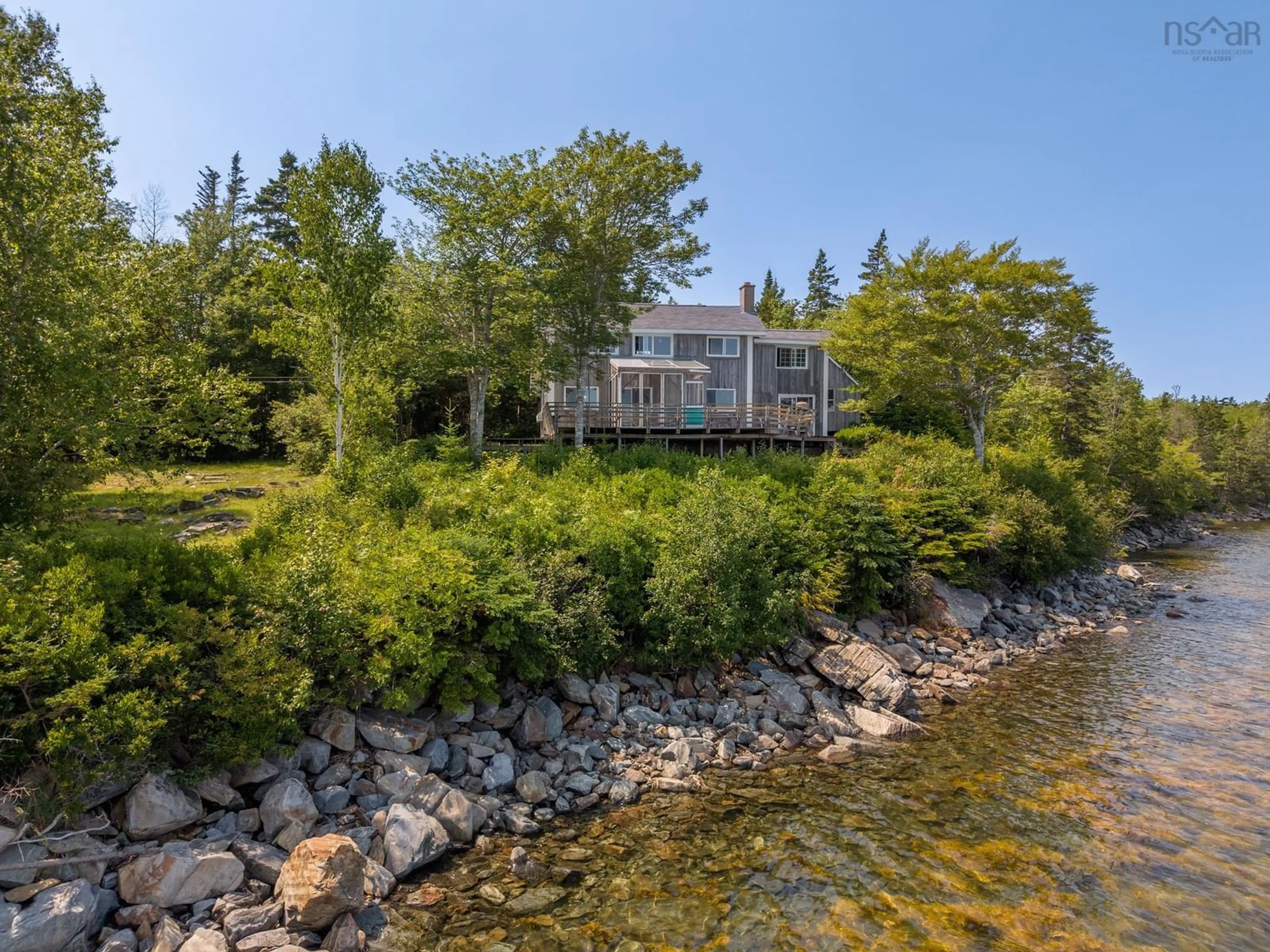 A pic from outside/outdoor area/front of a property/back of a property/a pic from drone, water/lake/river/ocean view for 390-406 Highway 308, Morris Island Nova Scotia B0W 3M0