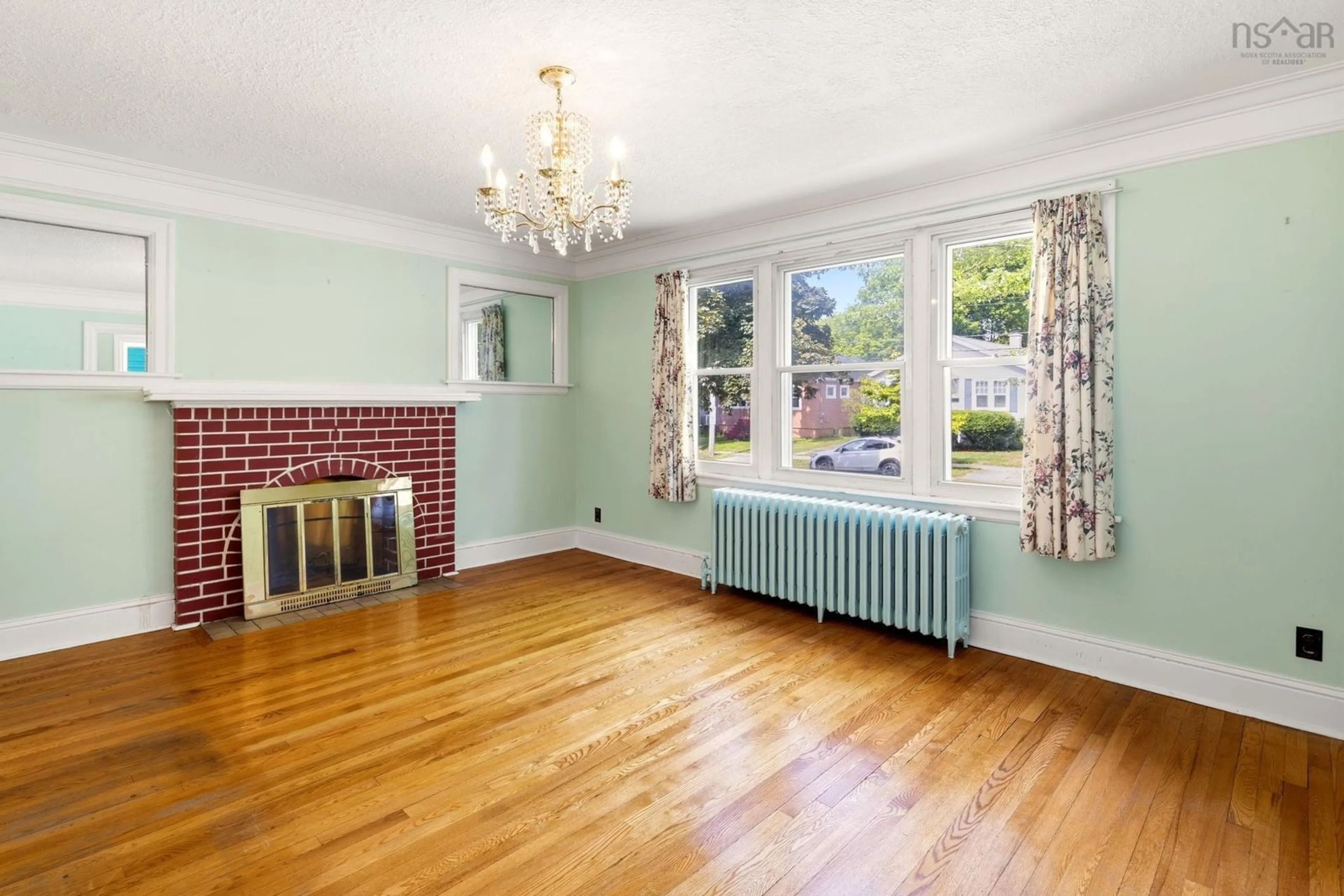 Living room with furniture, wood/laminate floor for 828 Bridges Street, Halifax Nova Scotia B3H 2Z7