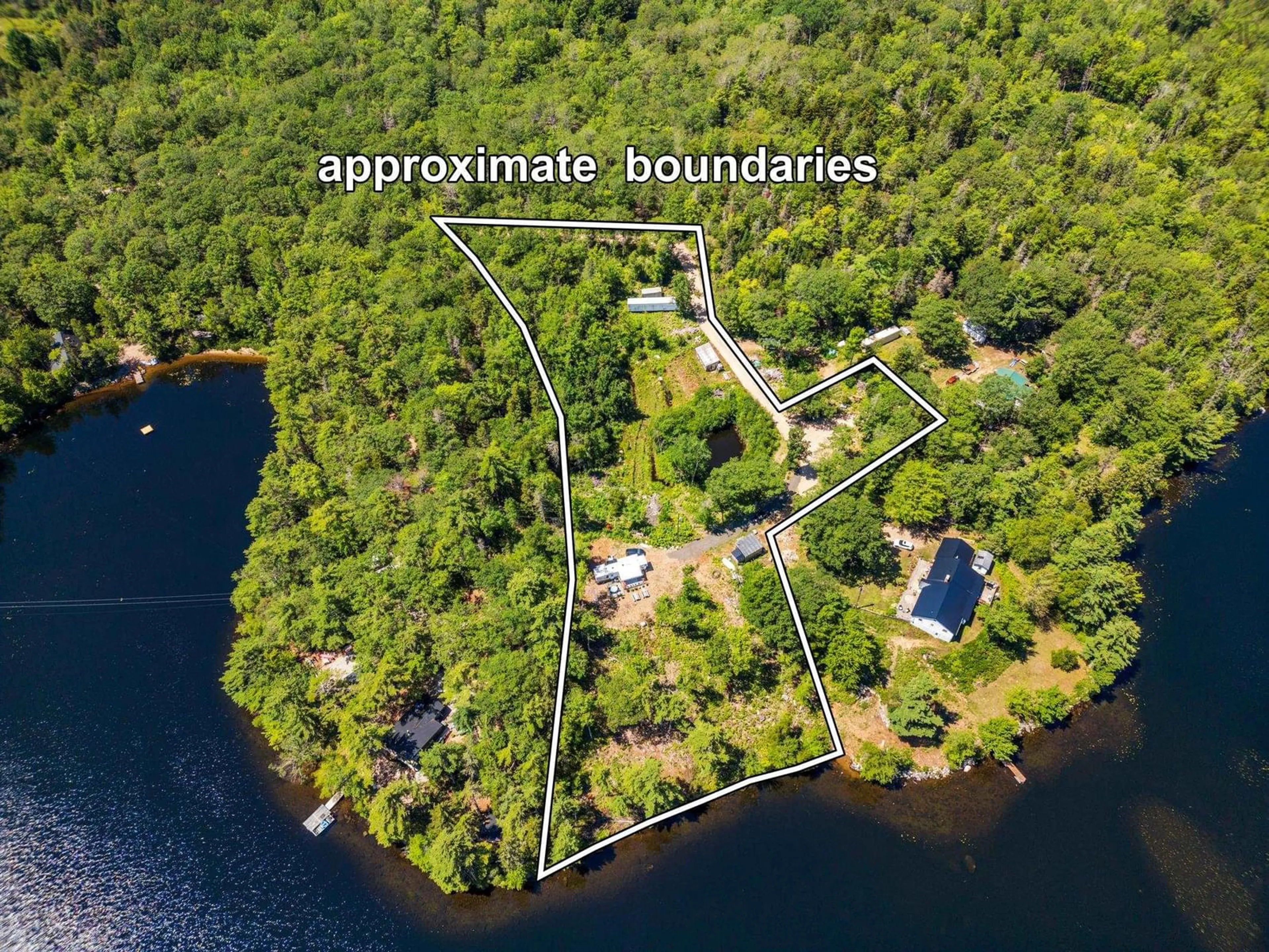 A pic from outside/outdoor area/front of a property/back of a property/a pic from drone, water/lake/river/ocean view for 33 Acorn Lane, Lake La Rose Nova Scotia B0S 1A0