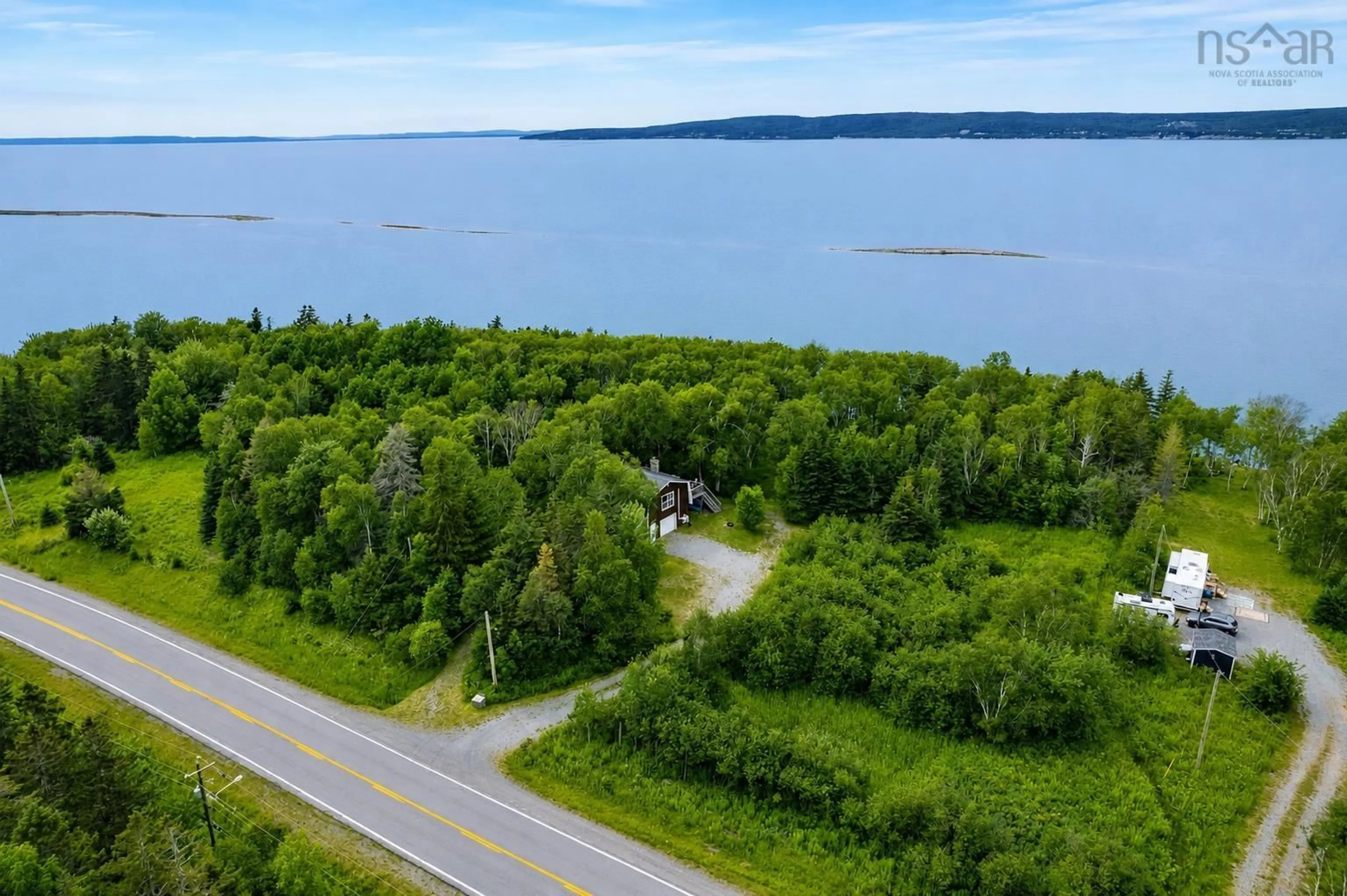 A pic from outside/outdoor area/front of a property/back of a property/a pic from drone, water/lake/river/ocean view for 8456 East Bay Hwy, Big Pond Centre Nova Scotia B1J 1Z6