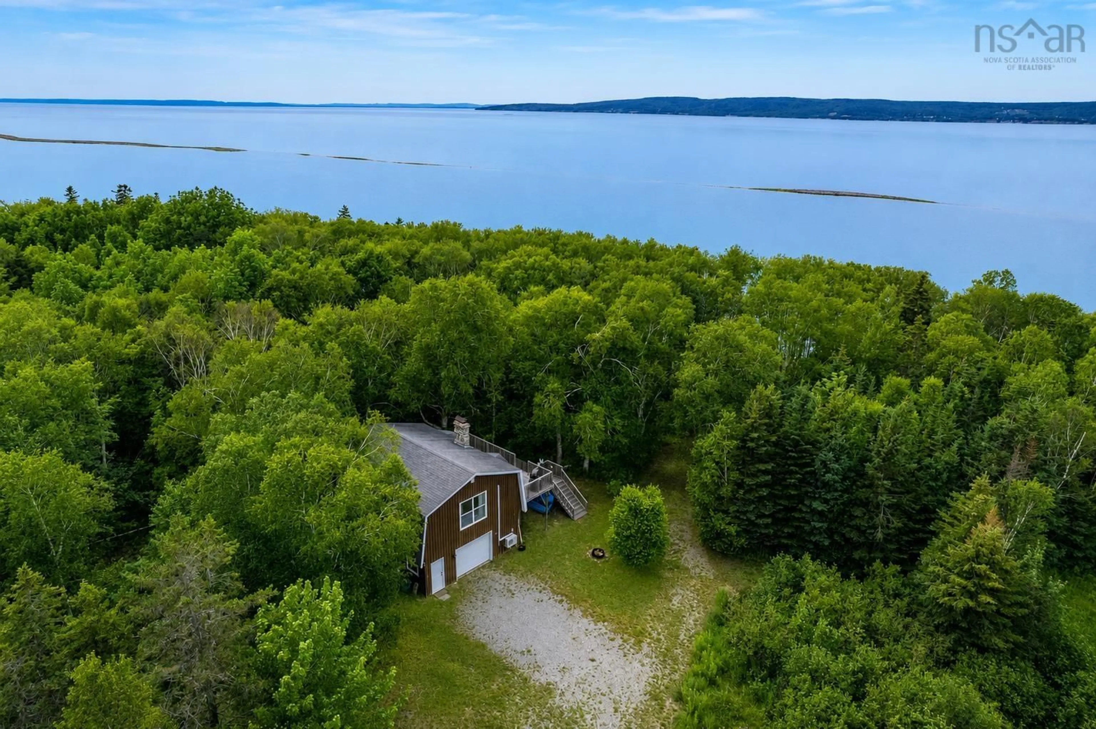 A pic from outside/outdoor area/front of a property/back of a property/a pic from drone, water/lake/river/ocean view for 8456 East Bay Hwy, Big Pond Centre Nova Scotia B1J 1Z6